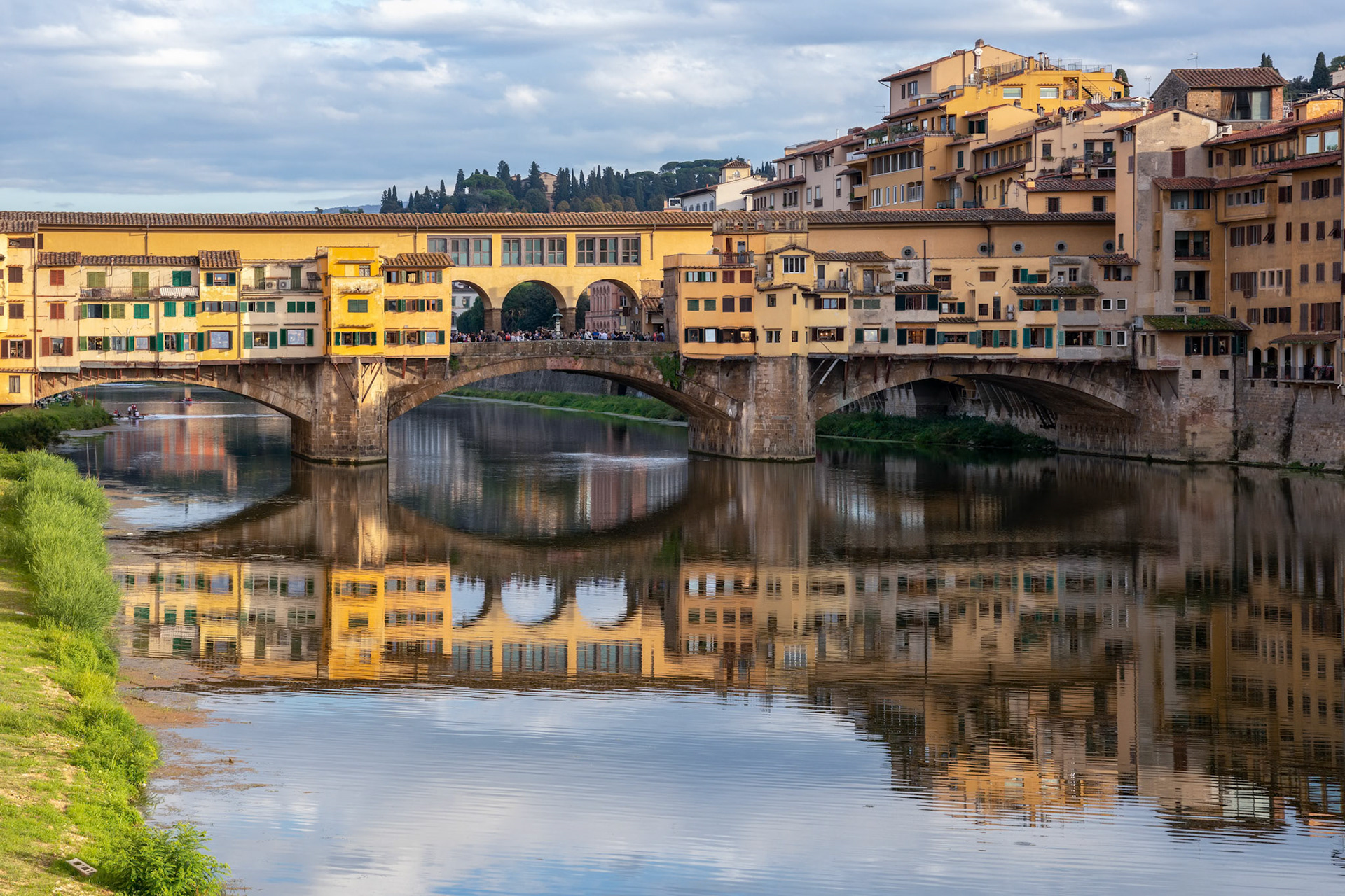 FLORENCE, TUSCANY/ITALY - OCTOBER 18 : View of buildings along and across the River Arno in Florence  on October 18, 2019. Unidentified people.