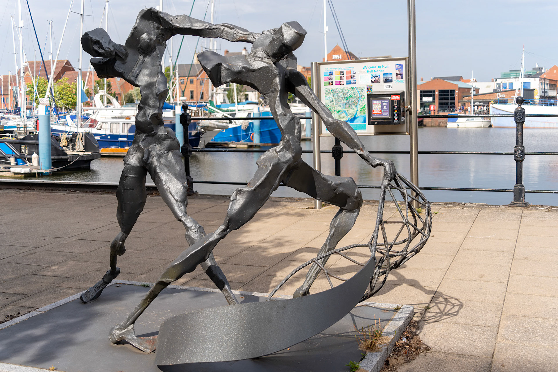 KINGSTON UPON HULL,  YORKSHIRE, UK - JULY 17: Sculpture of two fishermen catching fish with a net in Kingston upon Hull on July 17, 2022