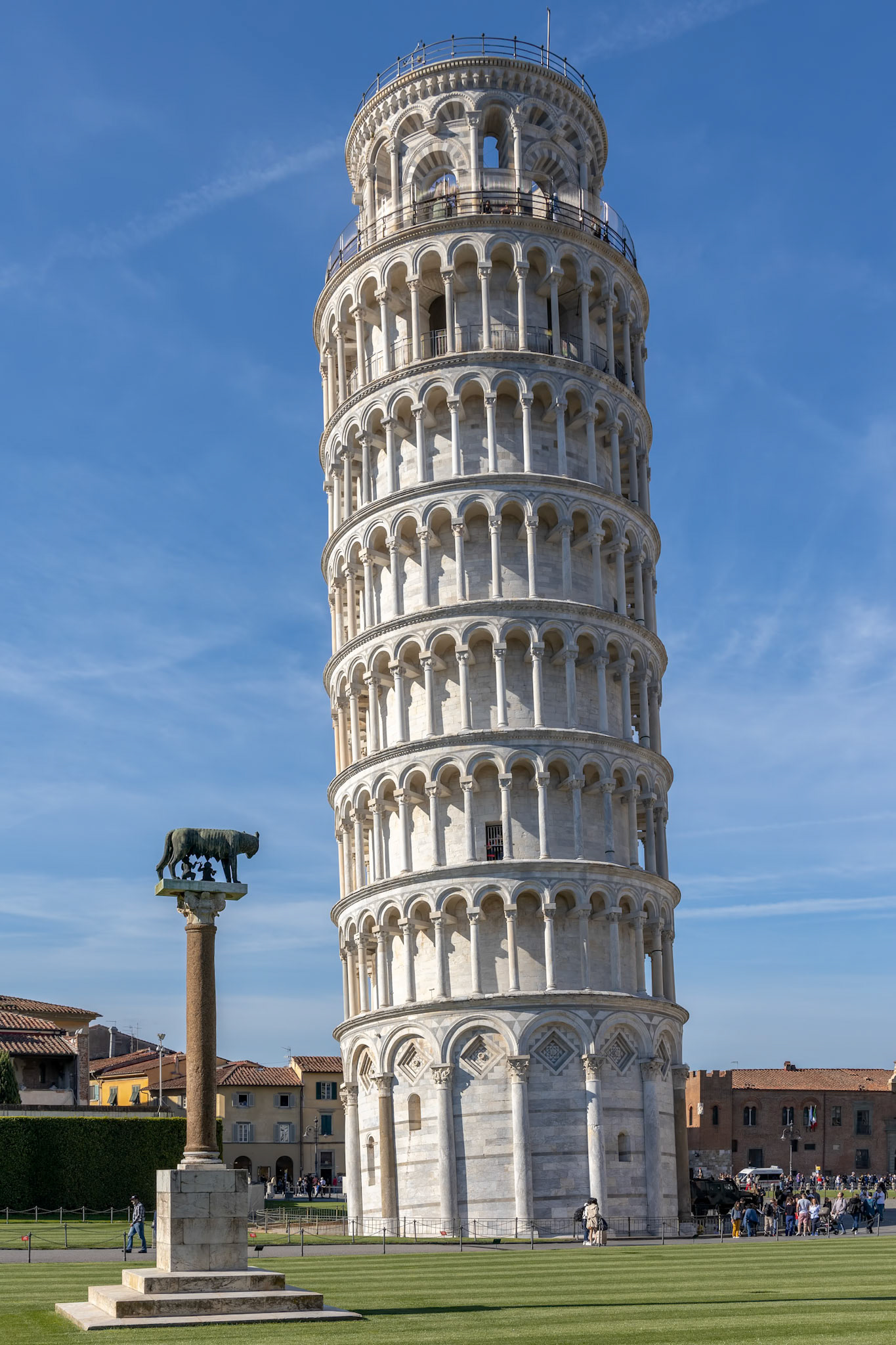 PISA, TUSCANY/ITALY  - APRIL 17 : Exterior view of the Leaning Tower of Pisa Tuscany Italy on April 17, 2019. Three unidentified people