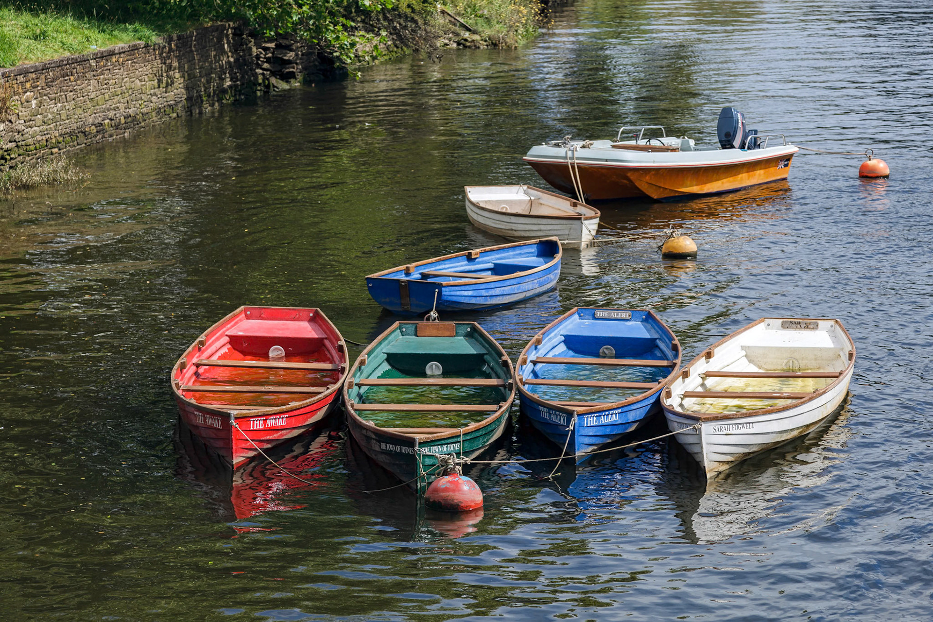 Group of Rowing Boats Full with Rainwater