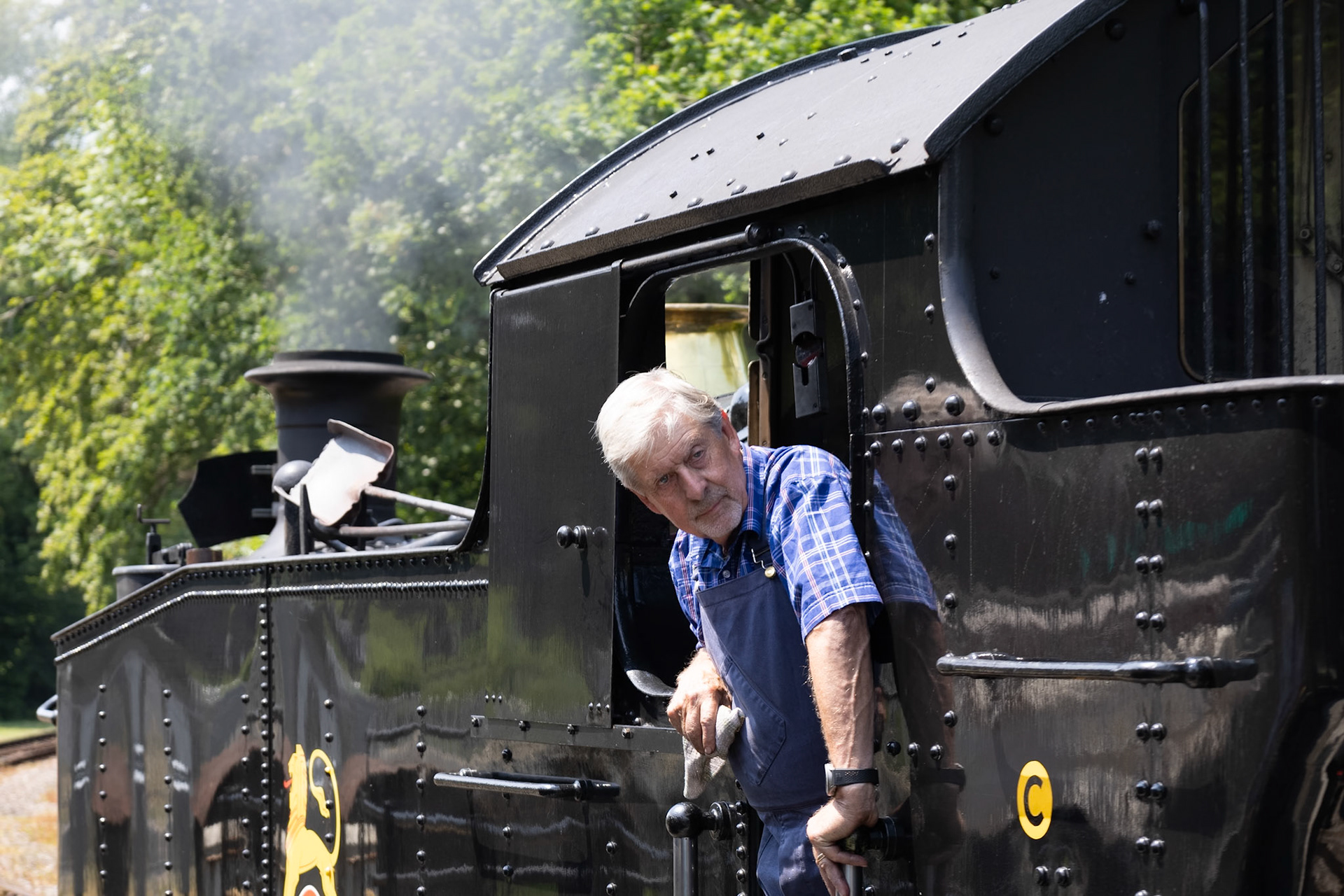 Boscarne, Cornwall, UK - June 13. Steam train at Bodmin, Cornwall on June 13, 2023. One unidentified man