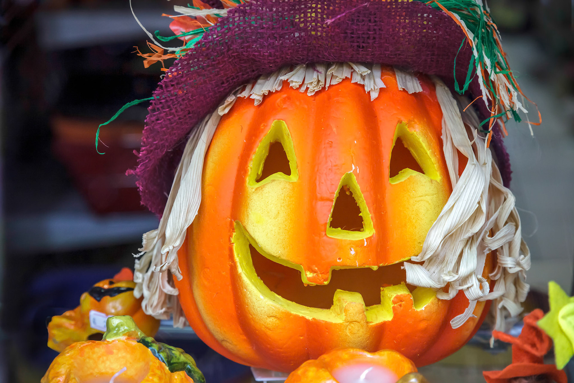 Close-up of a Pumpkin Carved Face in a Shop Window in Monza