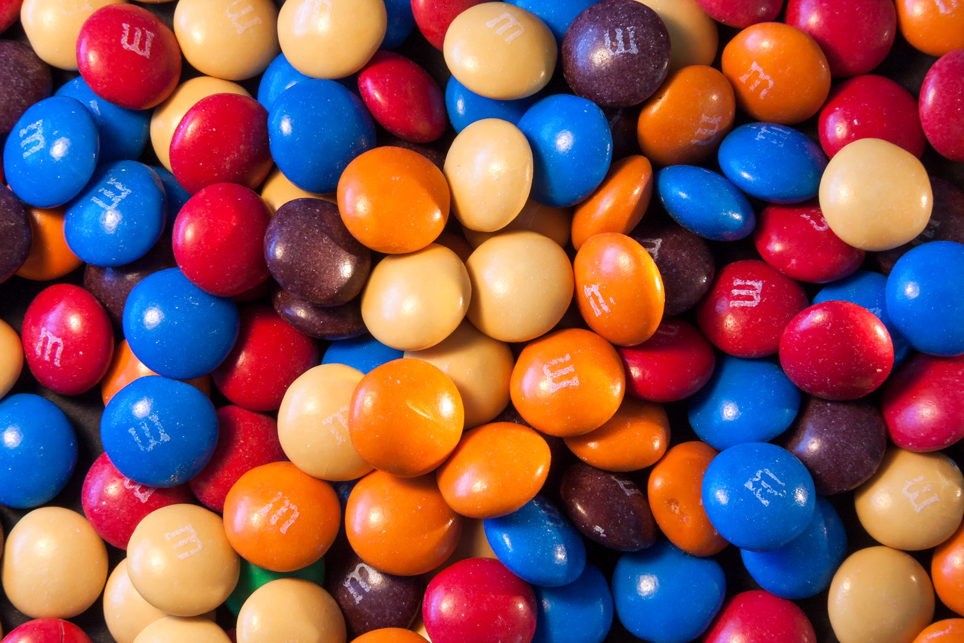 EAST GRINSTEAD, WEST SUSSEX/UK - MARCH 5 : Close-up of some multicoloured M&amp;Ms sweets in East Grinstead on March 5, 2008