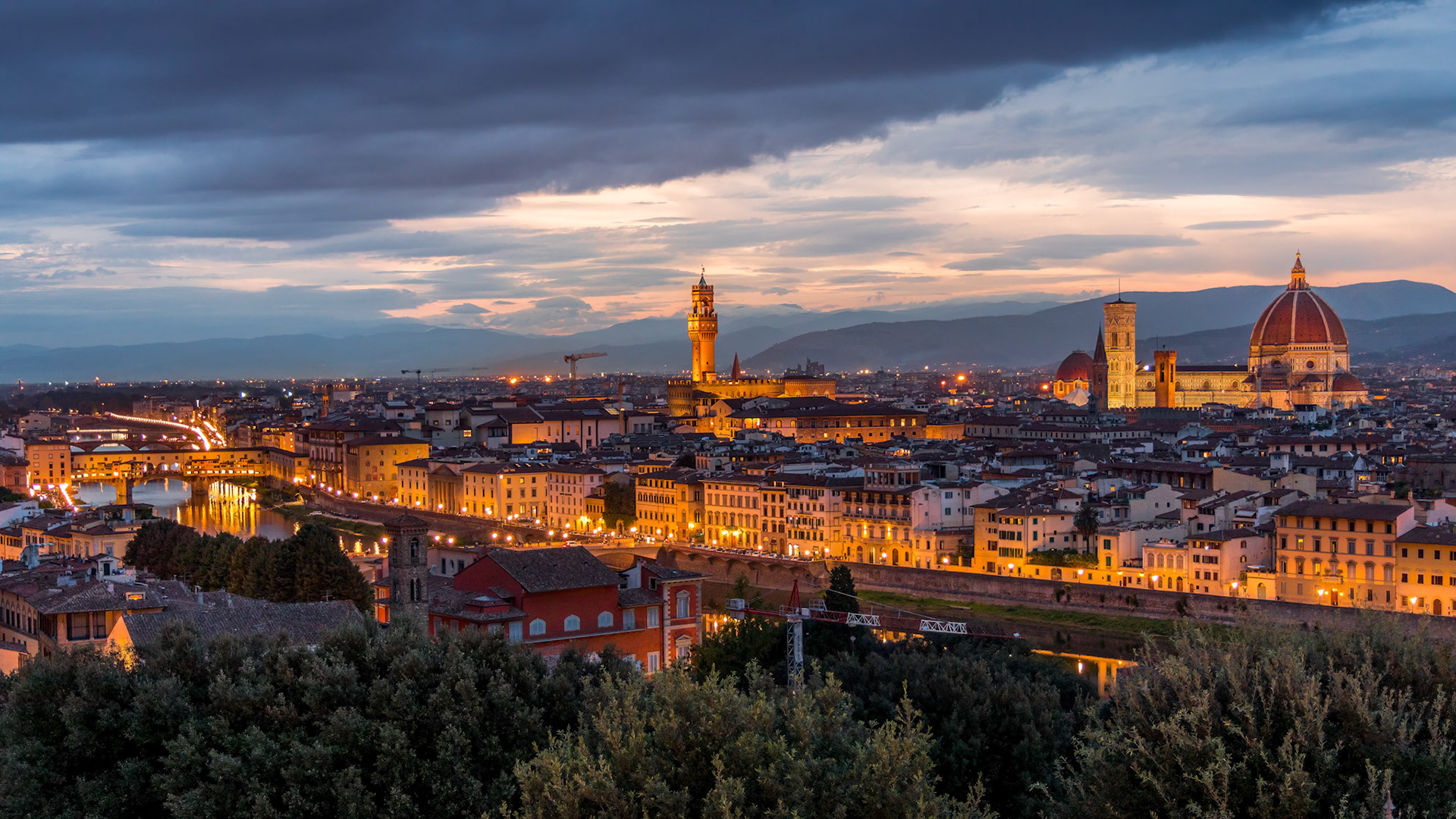 FLORENCE, TUSCANY/ITALY - OCTOBER 18 : Distant view of Florence Cathedral at dusk in Florence on October 18, 2019