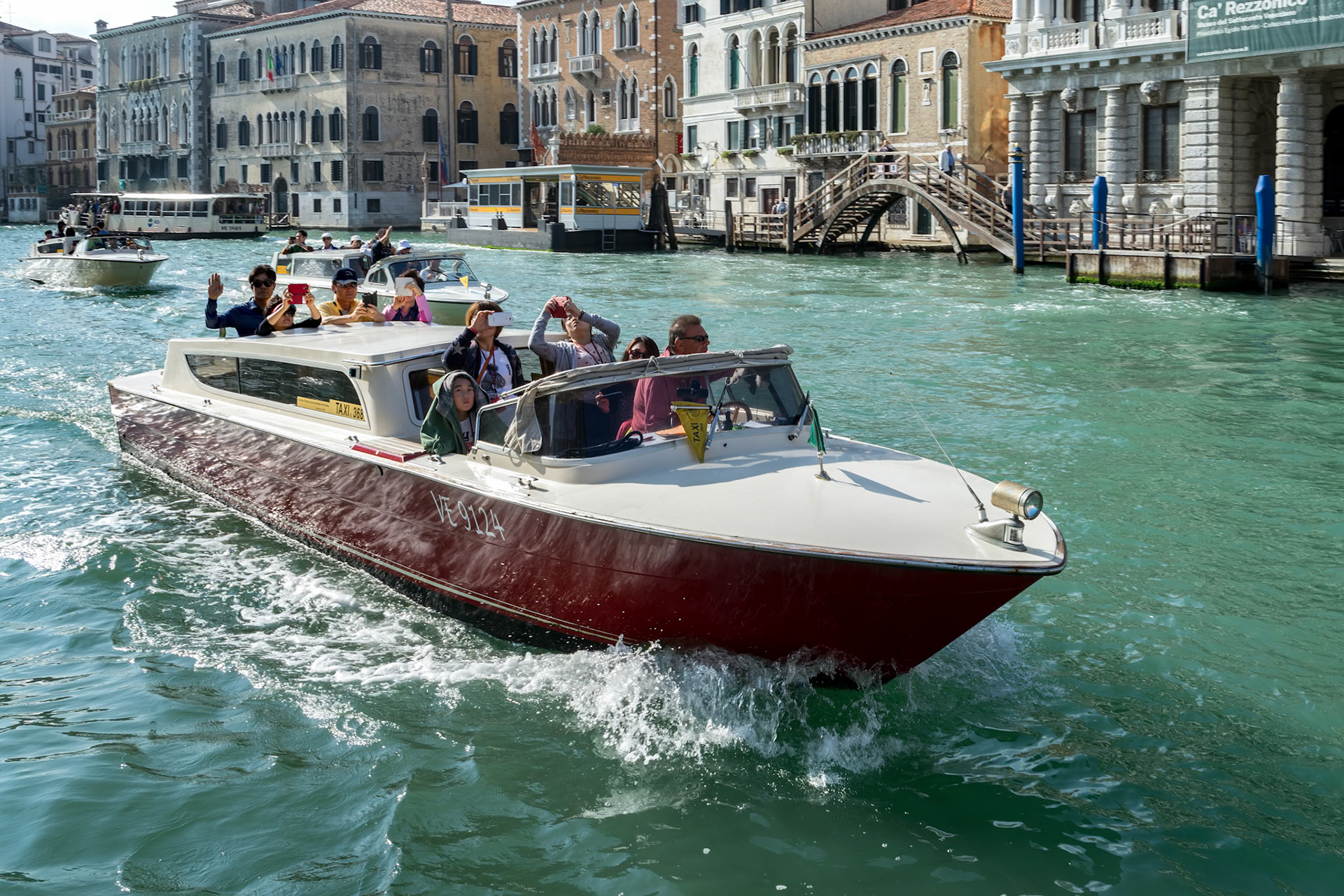 VENICE, ITALY - OCTOBER 12 : Motorboat Cruising down the Grand Canal in Venice on October 12, 2014. Unidentified people.