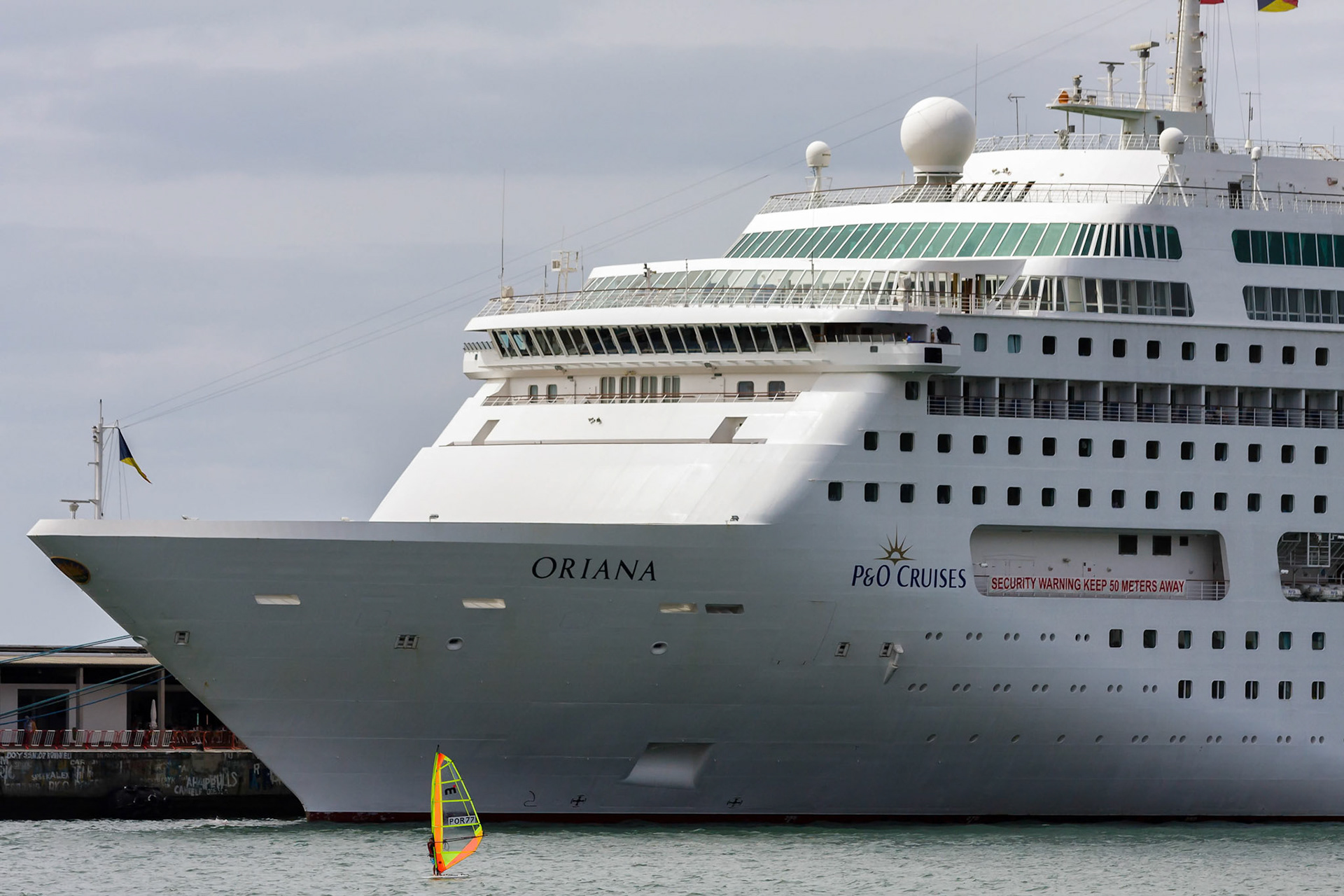 Windsurfer in Funchal Harbour Appears Insignificant against Cruise Ship