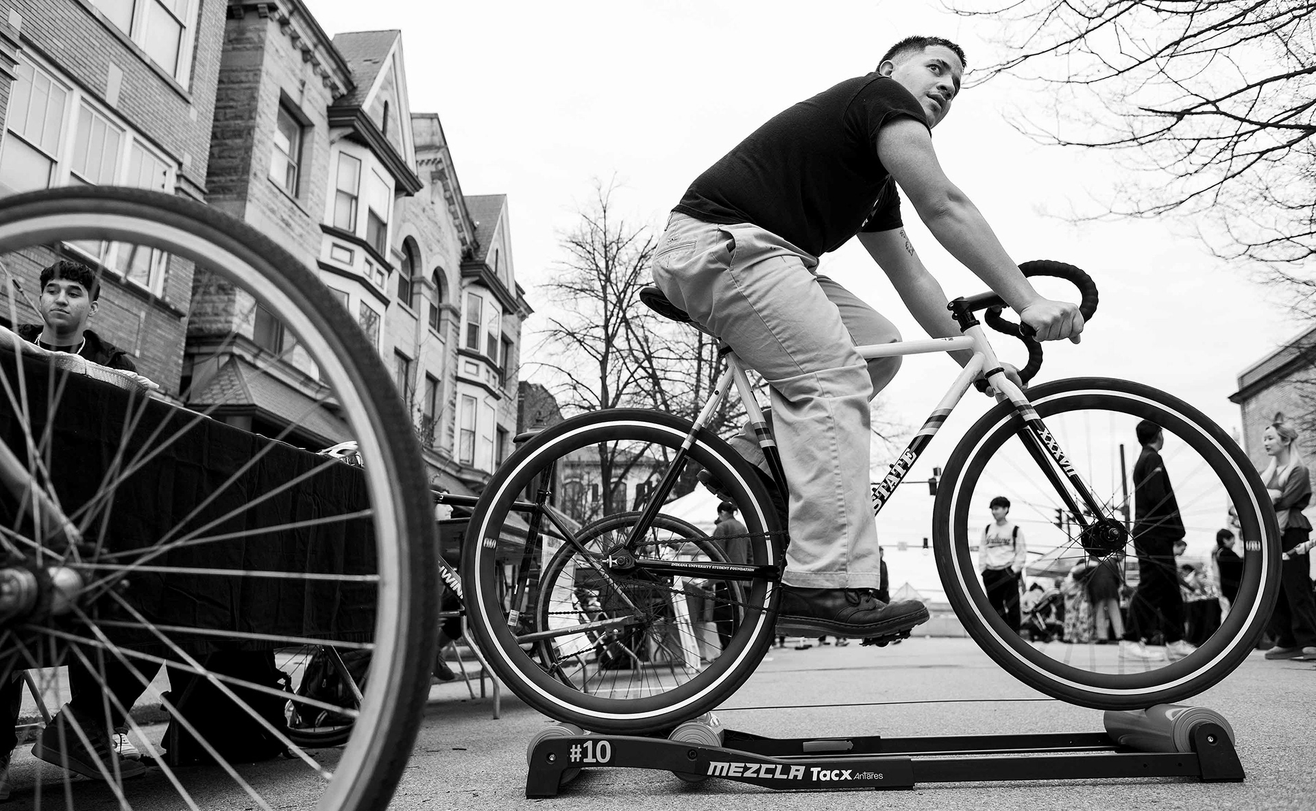Street fair stationary cyclist.
