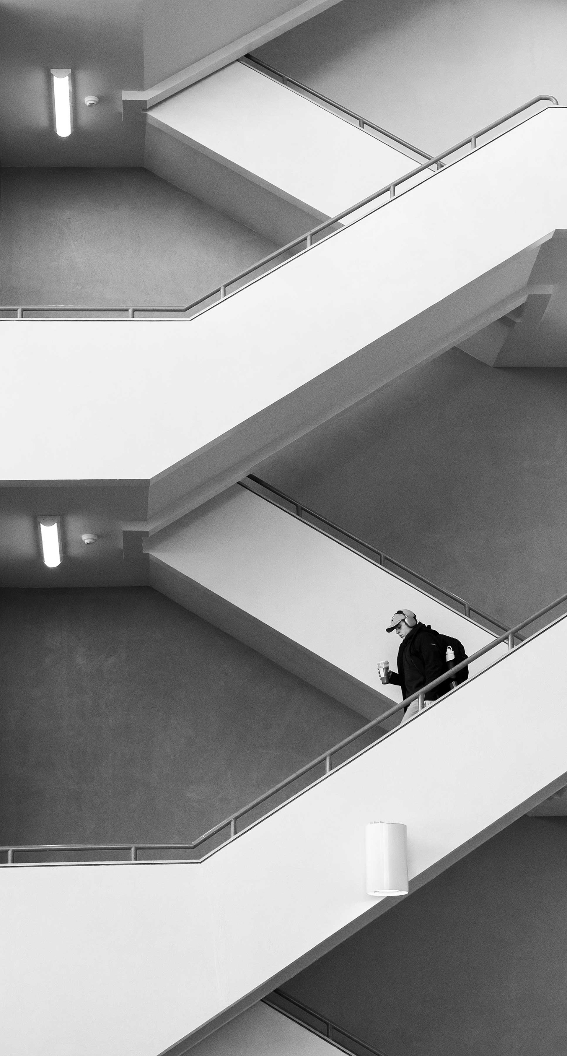 A student descends the stairs.