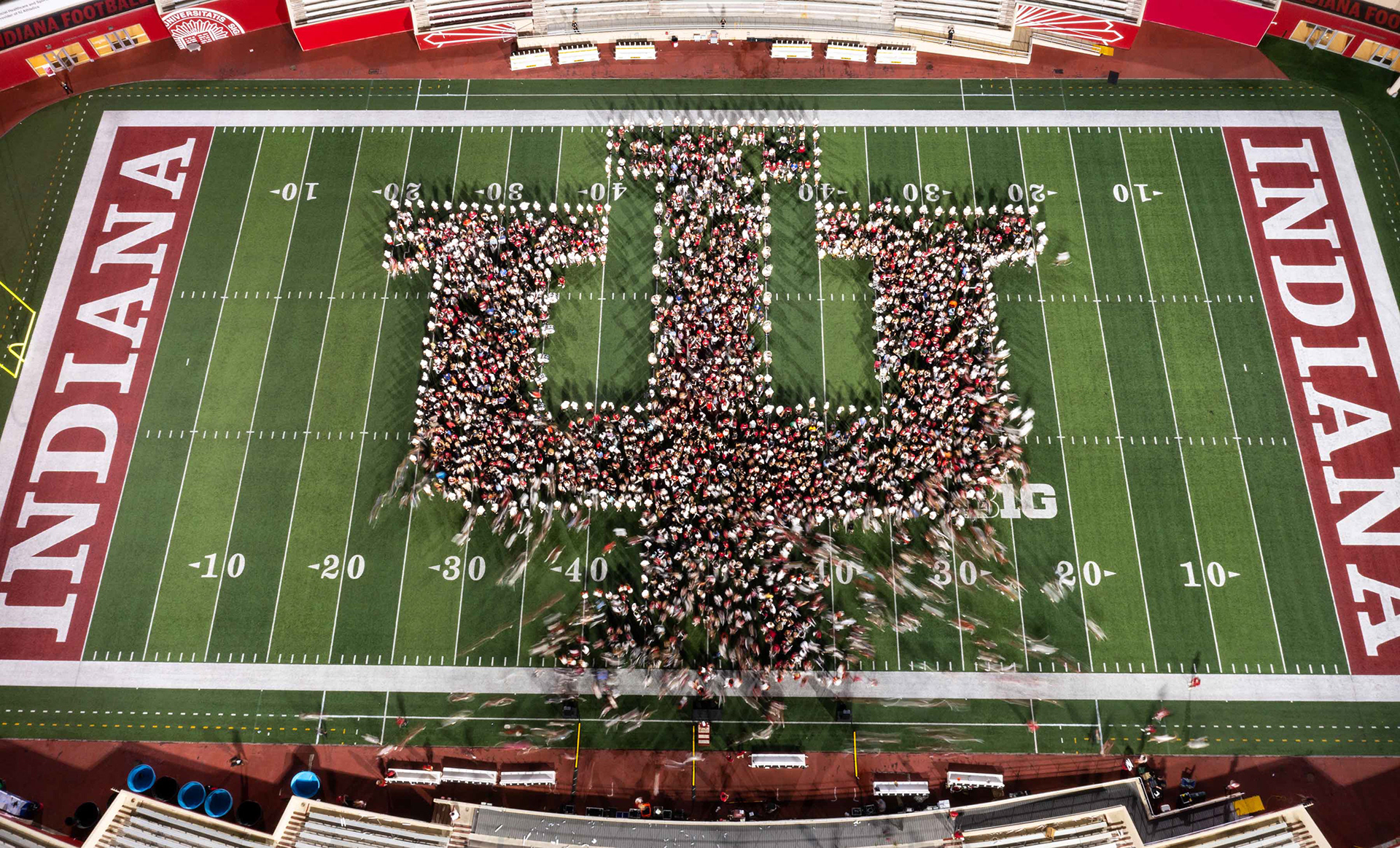 Long exposure of students forming the IU trident at Memorial Stadium.