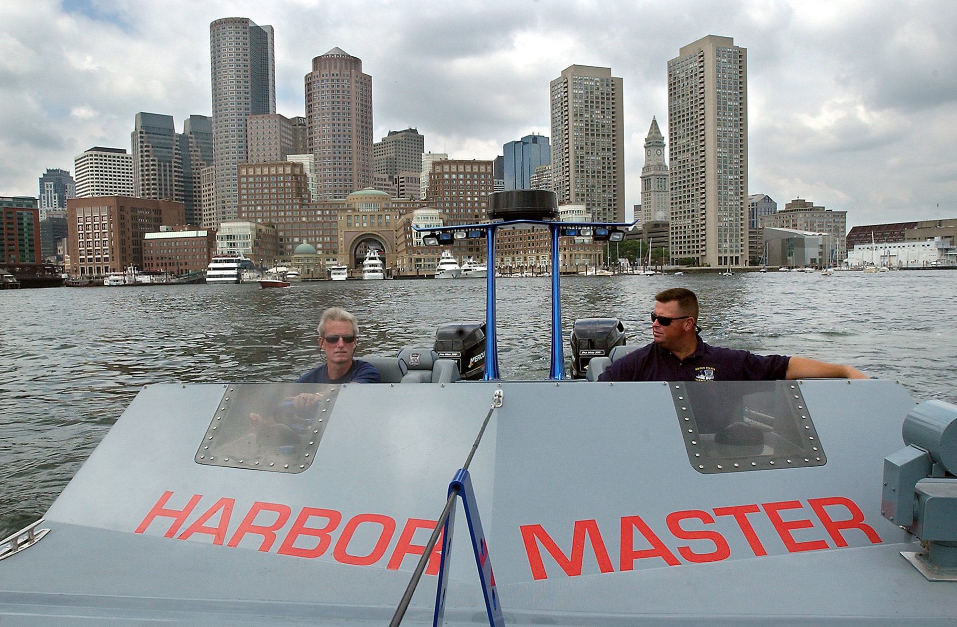 Boston Police Department Sgt. Robert Guiney, left, and officer Jeff Tobin patrol Boston Harbor in the Night Cat 27 boat. 