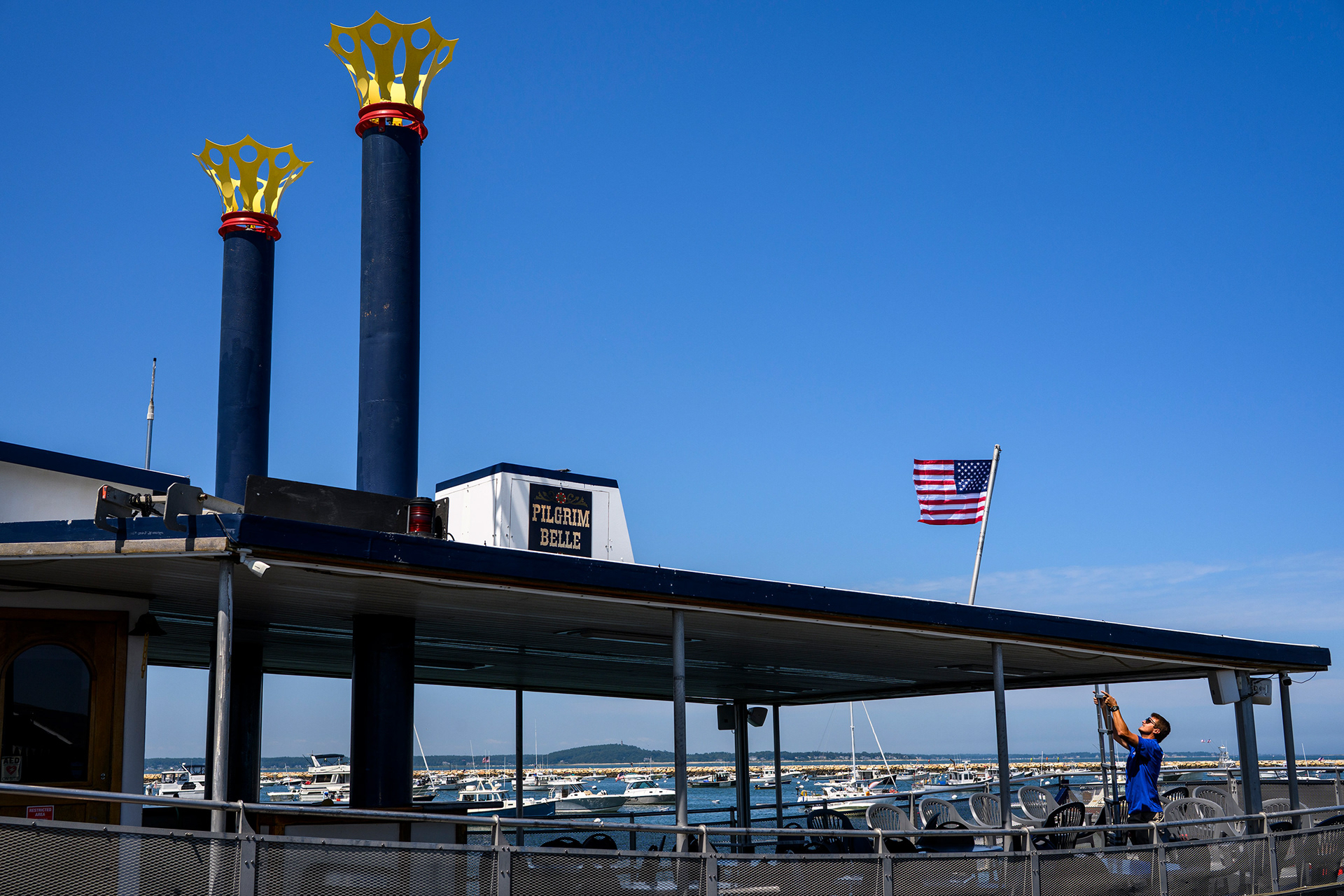 Boat crew member prepares for a cruise in Plymouth, MA.