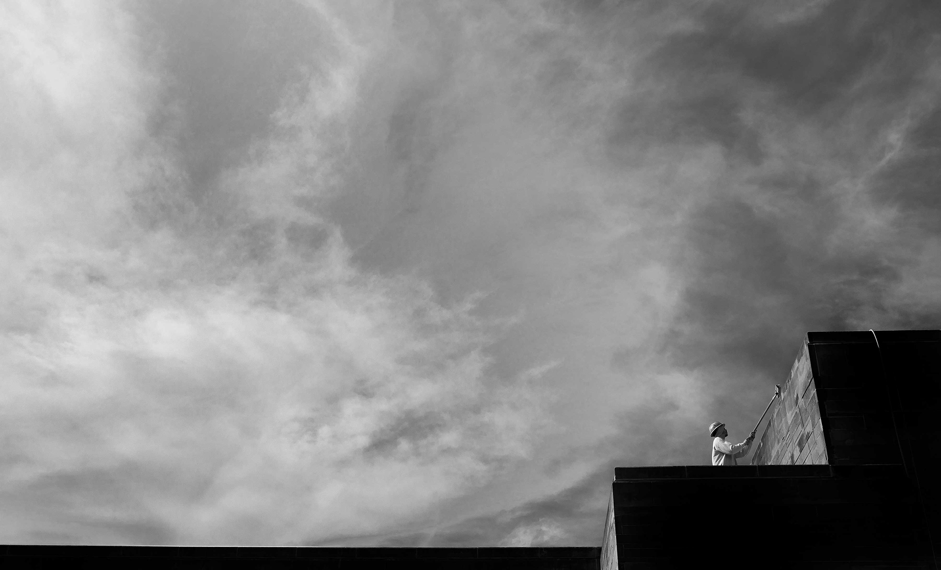 A maintenance worker on the roof.
