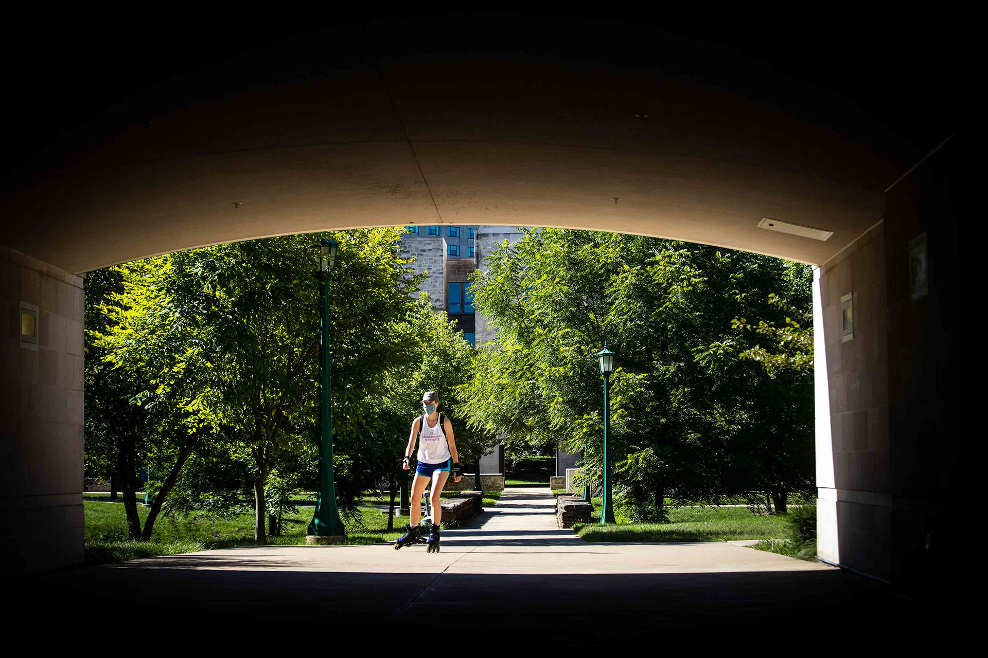 A student rollerblades toward a tunnel at Union Street Center.