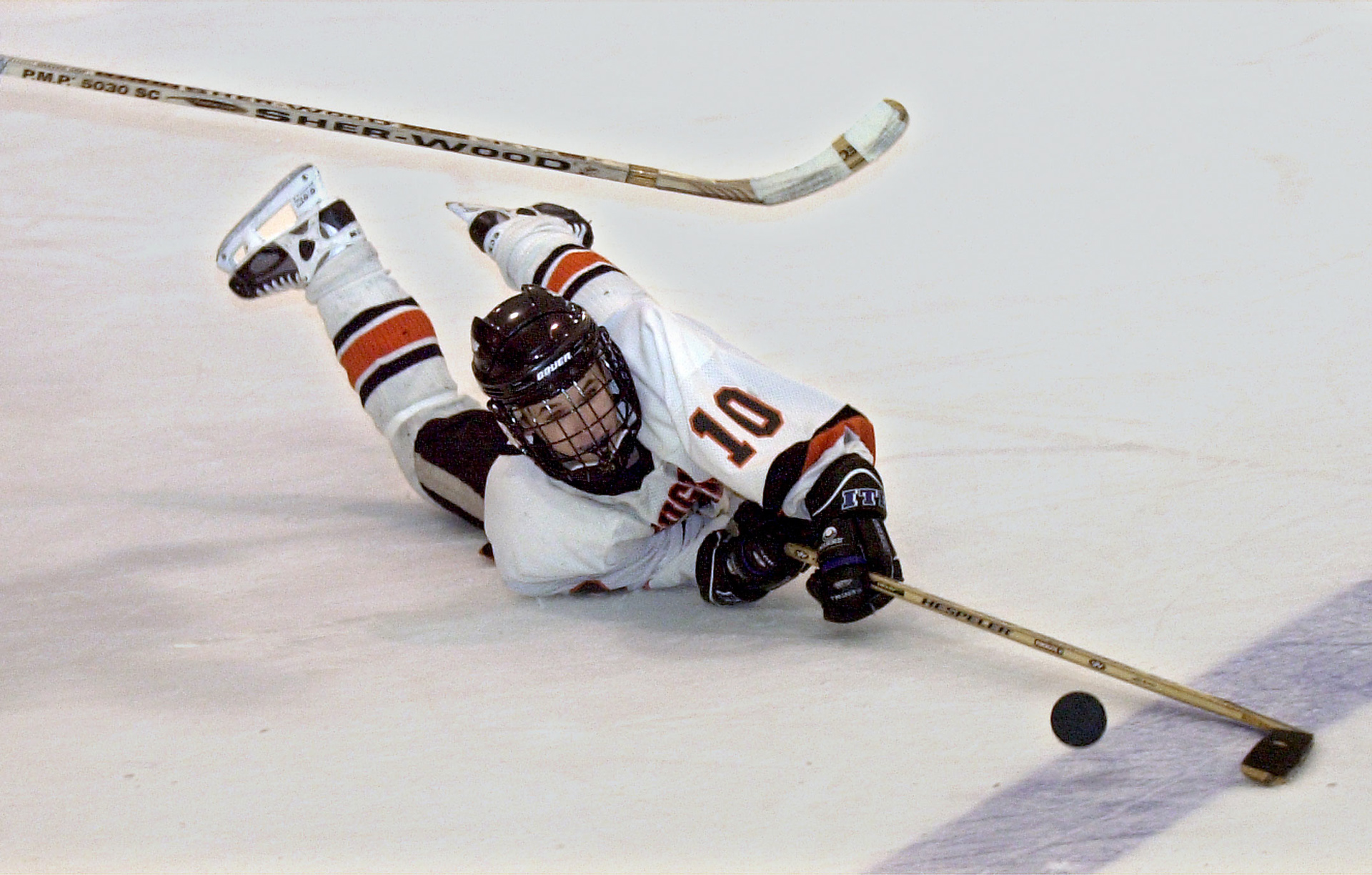 Paul Bishop dives onto the ice in pursuit of a loose puck.