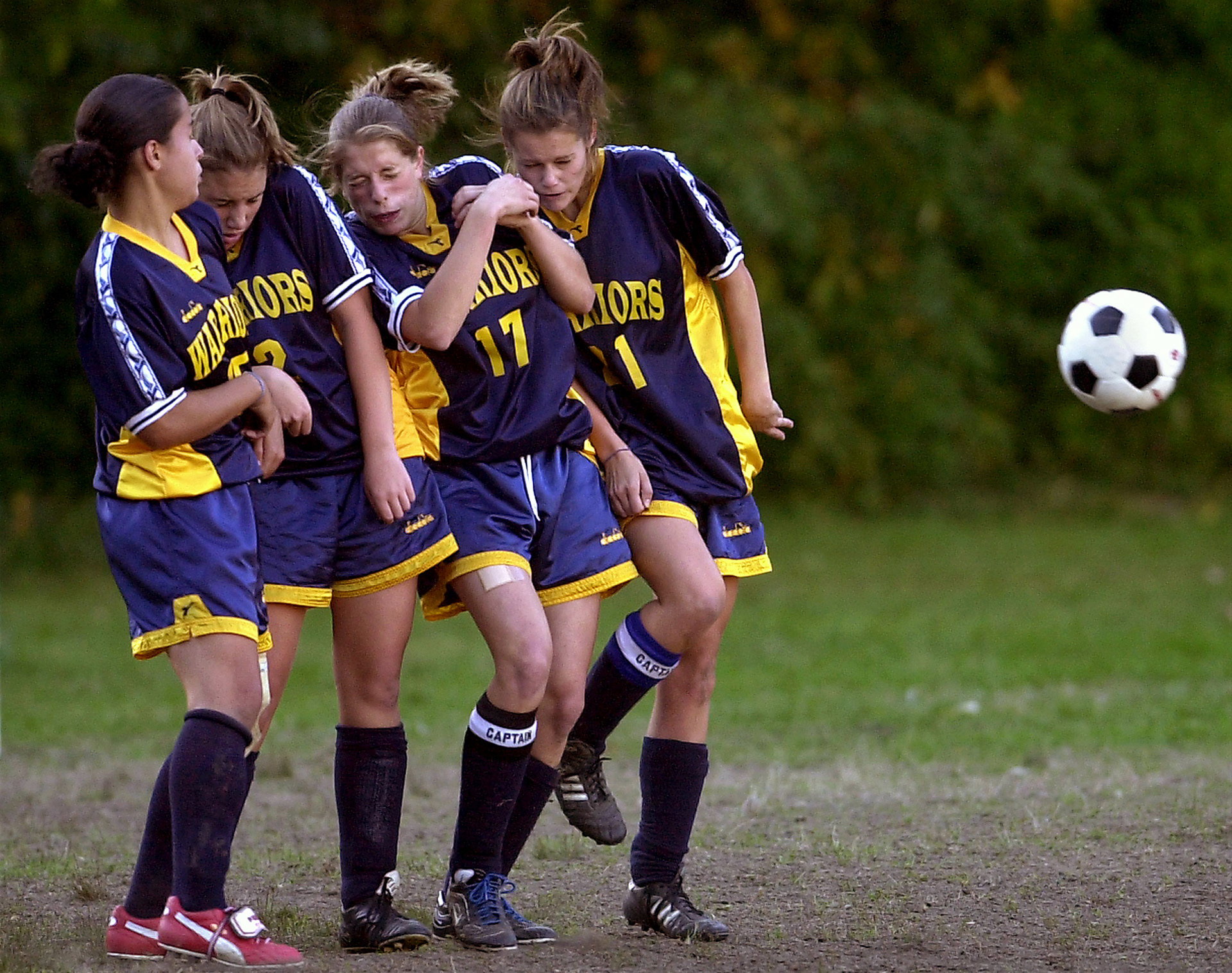 Coyle-Cassidy players, from left, Krystal Roberts, Justine Horsman, Kelly Marra and Jessica Butler cringe as they set up a wall to block an Attleboro direct kick.