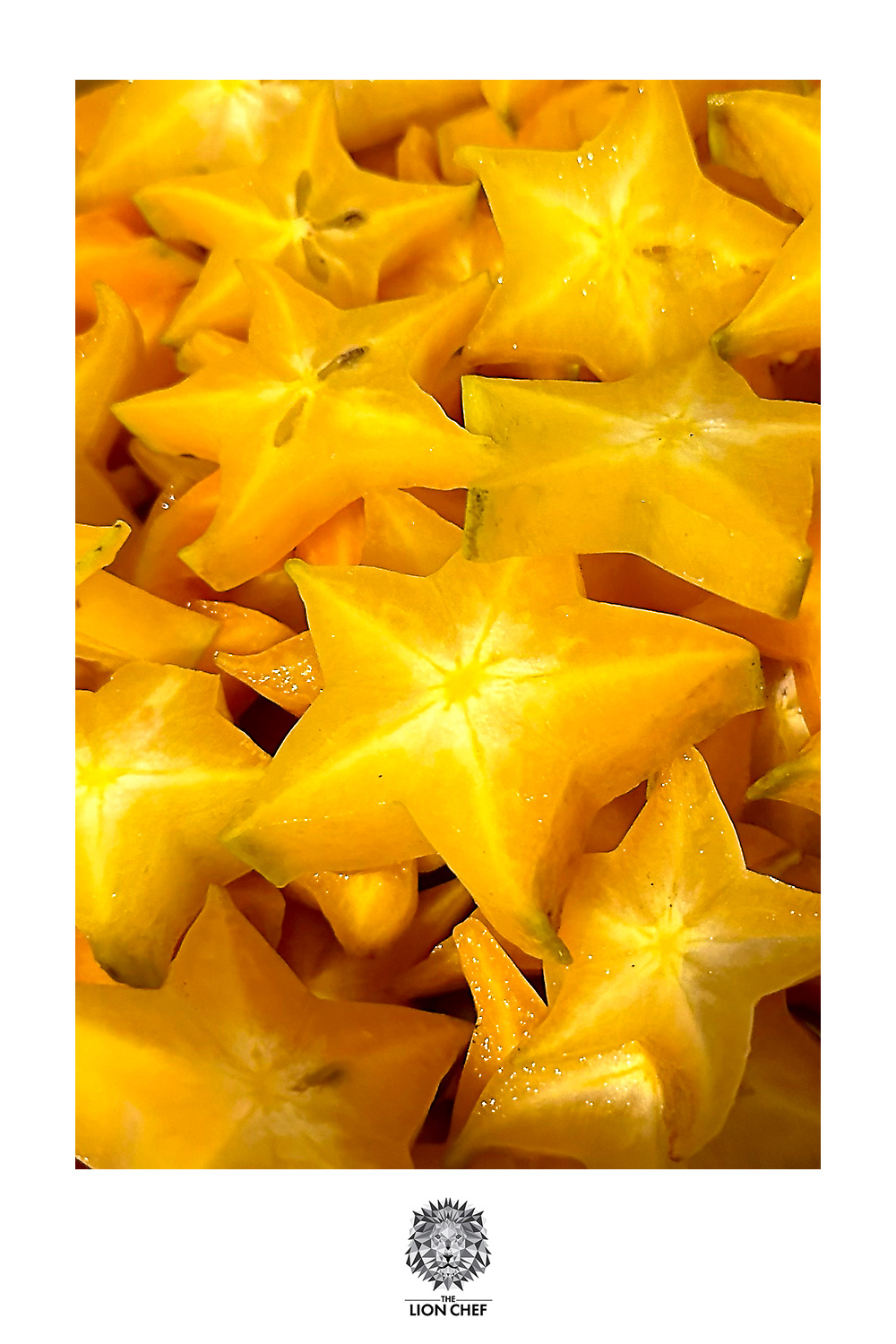 A close-up image of freshly cut star fruit pieces in a pot, ready to be cooked down for homemade star fruit jam. The vibrant yellow slices showcase the star-shaped pattern, highlighting their natural beauty and freshness in the jam-making process.