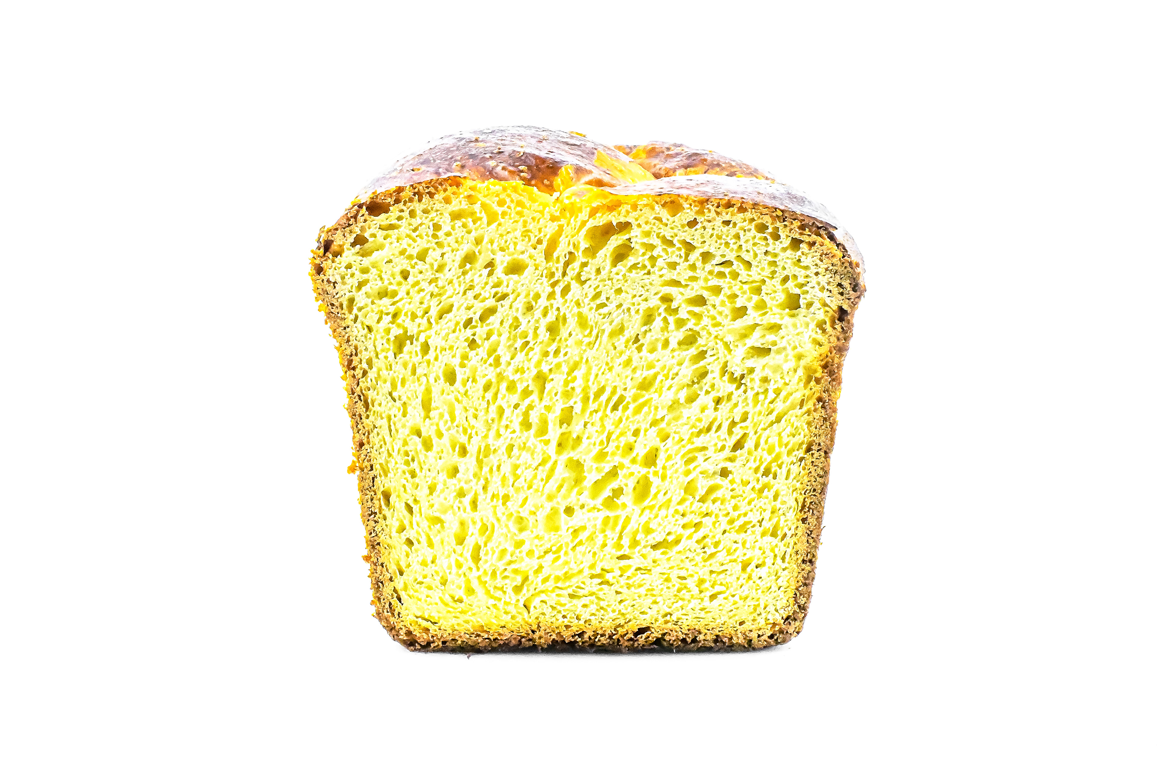 A sliced French brioche loaf on a white background, showcasing its soft, fluffy interior and golden brown crust. The rich, buttery texture is visible in the close-up, highlighting its perfect bake and ideal use for breakfast or holiday treats.