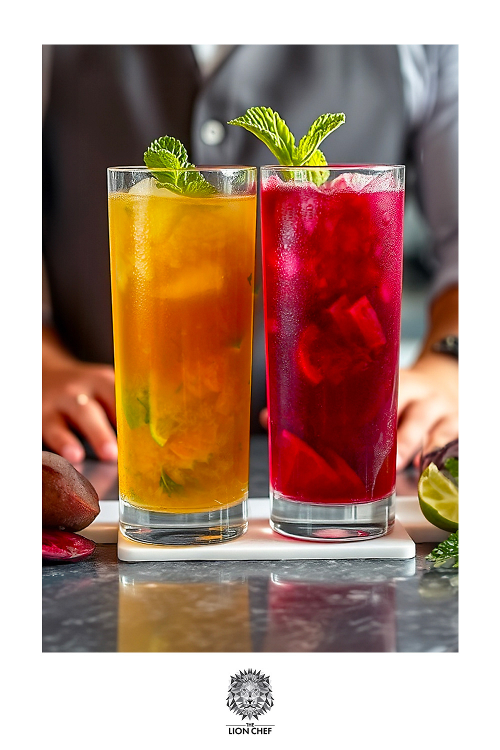 Two freshly made beet mojitos, one vibrant yellow and the other deep red, placed in front of the bartender on a sleek bar counter. The bartender, wearing a grey vest, is partially visible with hands positioned near the drinks, ready to serve. The contrasting colors of the mojitos stand out, highlighting their fresh ingredients and creative presentation.