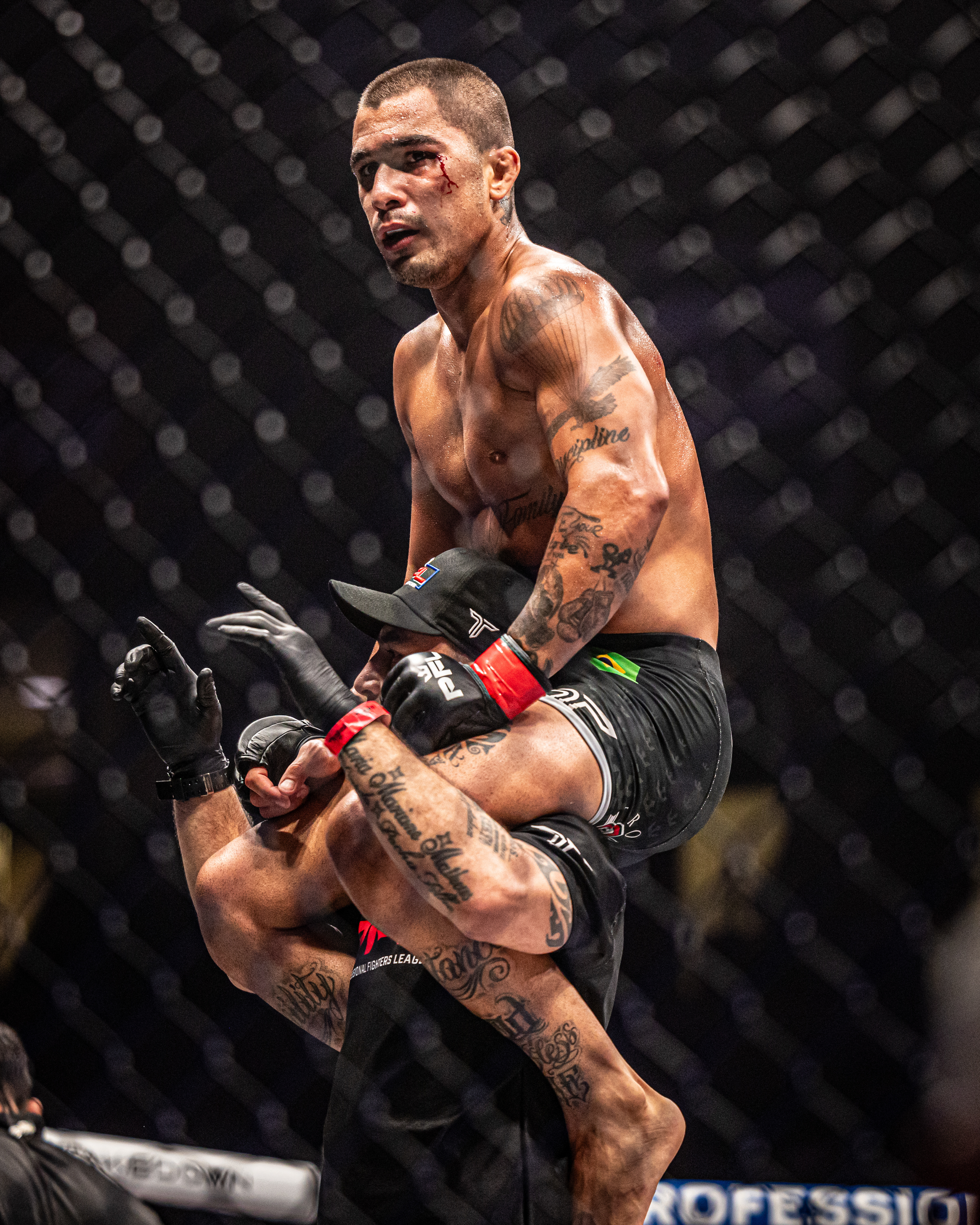 Gabriel Braga is lifted in celebration after earning a knockout victory at the Professional Fighters League event in Sioux Falls on June 28, 2024. Bloodied but triumphant, Braga’s emotion reflected the intensity of the bout and the magnitude of the win.