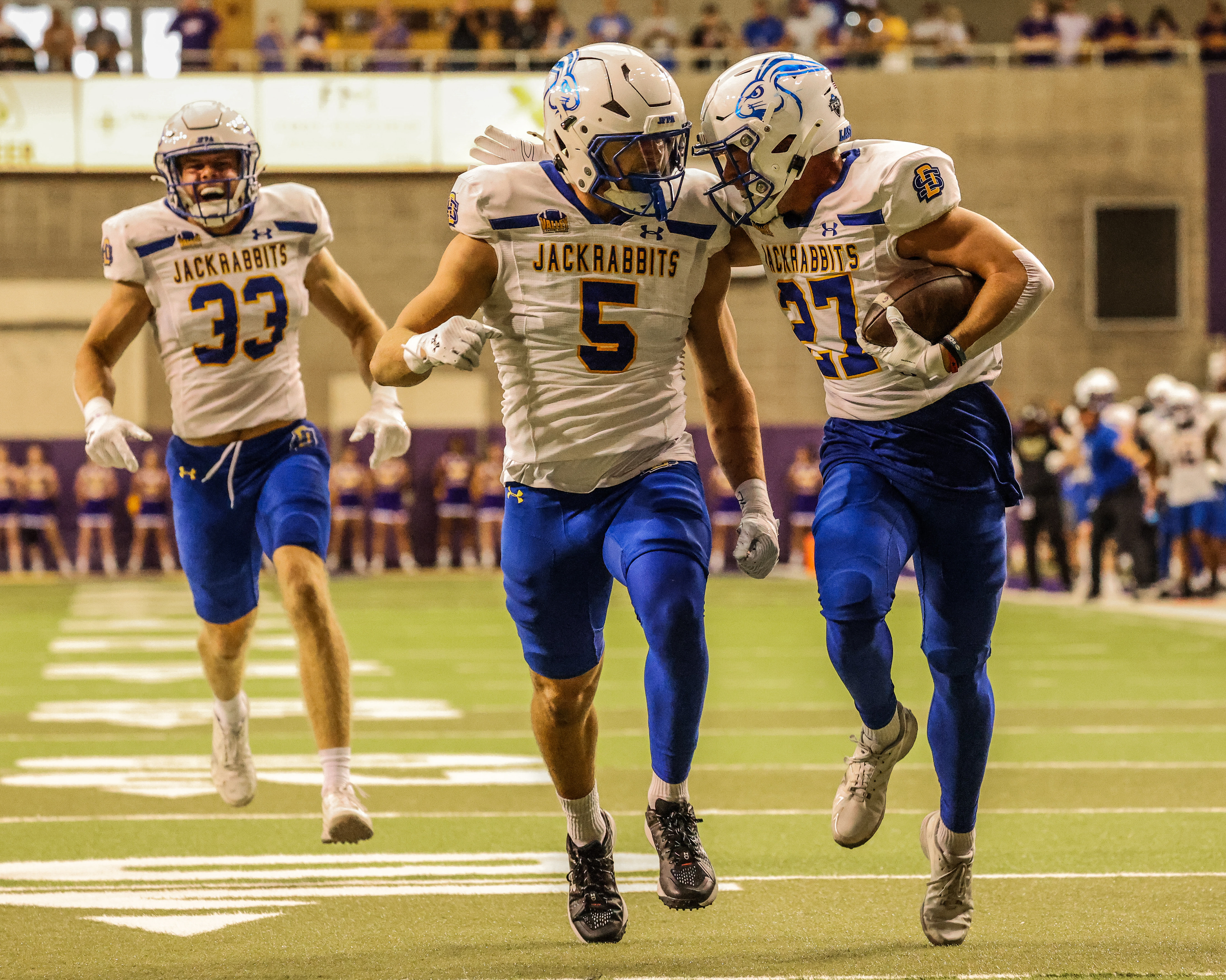 South Dakota State’s Noah Thompson celebrates with Cullen McShane after returning a blocked punt for his first career touchdown at the UNI-Dome.