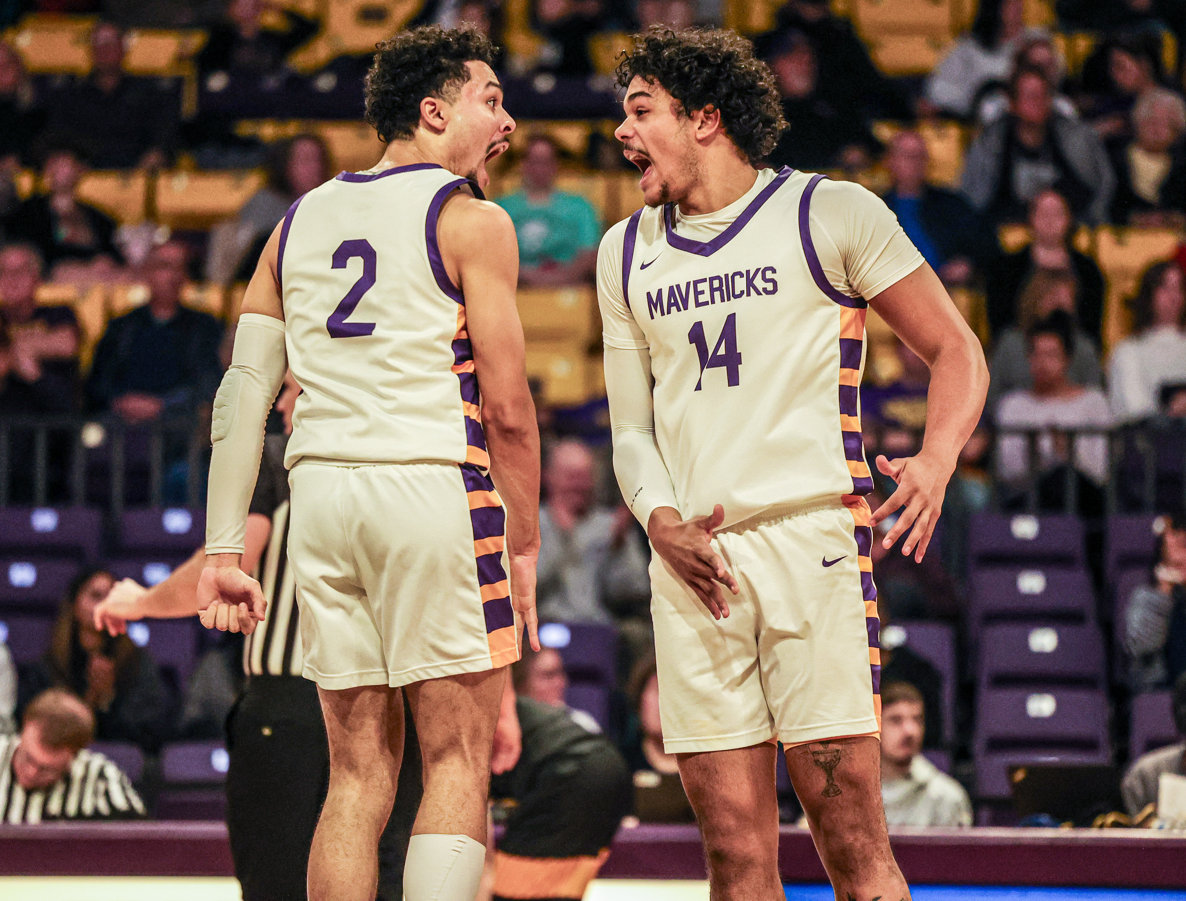 Minnesota State’s Malik Willingham and Malcom Smith celebrate after Smith drilled a three-pointer during an 18-point run.