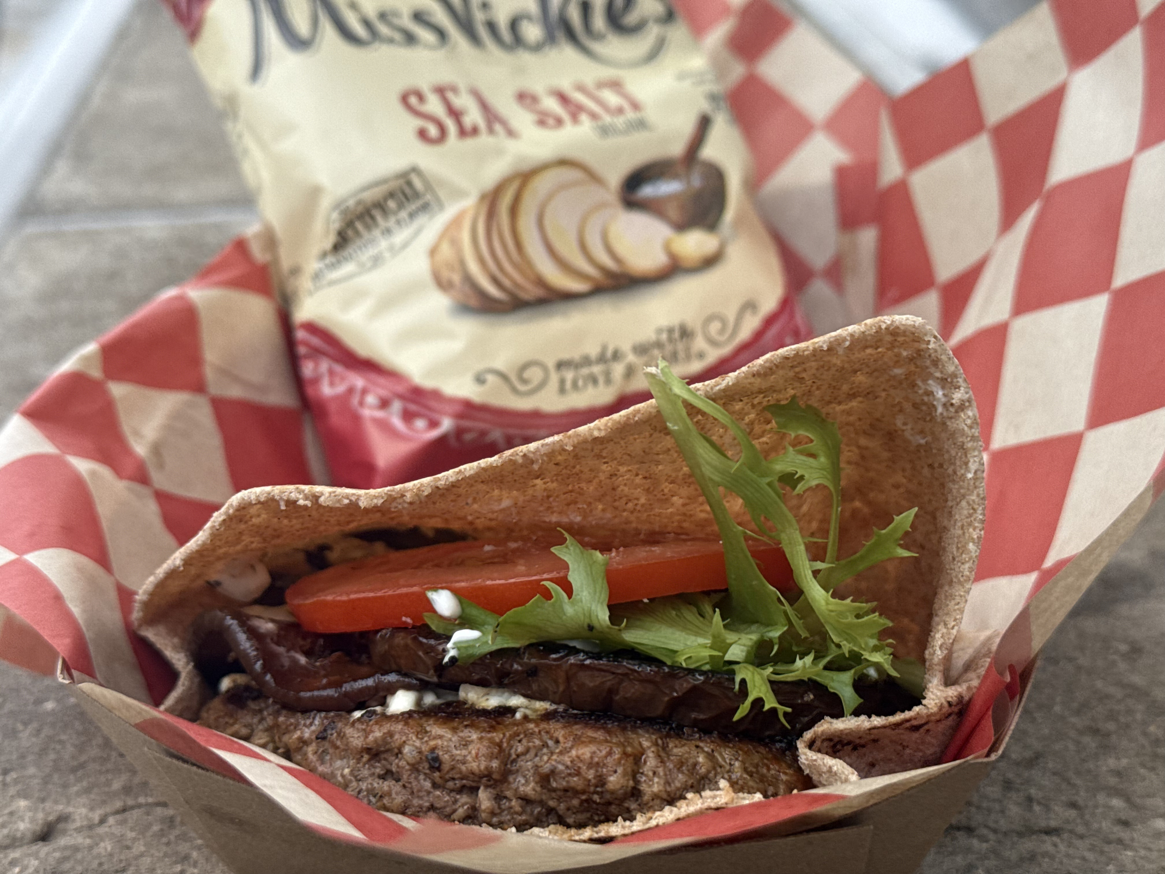 Lamb Burger - Club David - Ground lamb, feta, marinated eggplant, tzatziki sauce, and field greens served with chips.