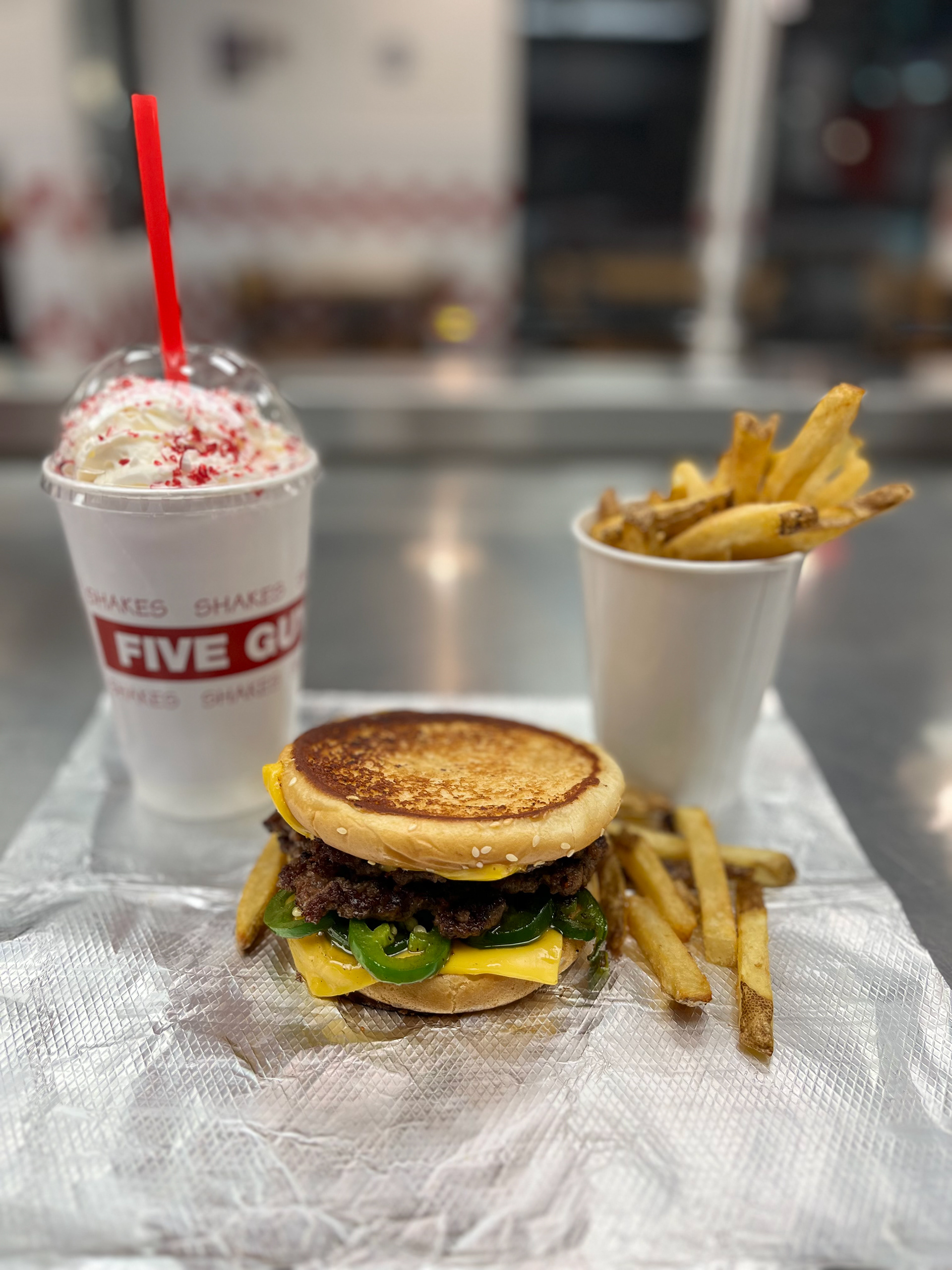 Jalapeno Popper Burger - Five Guys - Two juicy all American beef patties on our signature Five Guys buns with American cheese and grilled jalapeño peppers. 