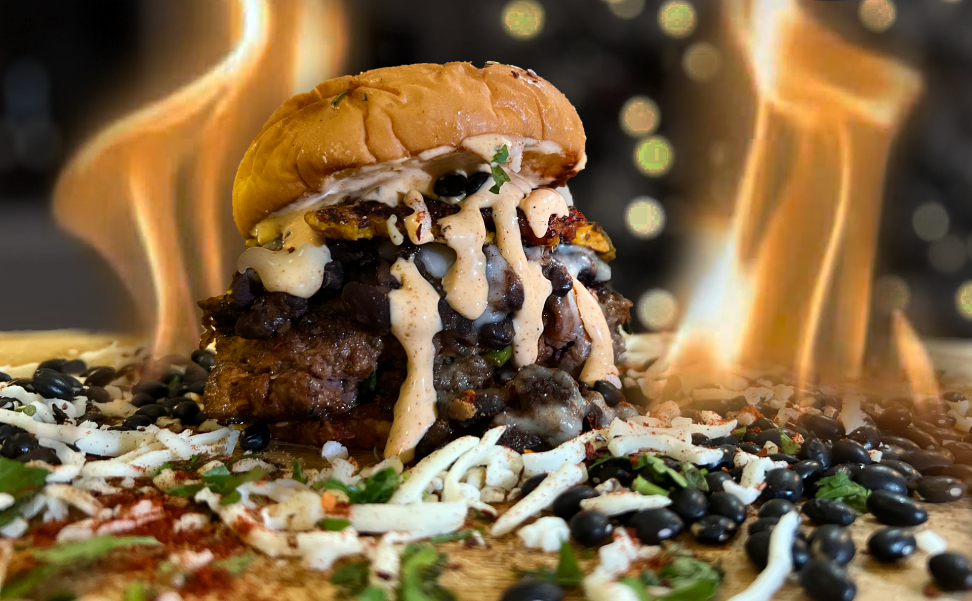 Alcobaca - Roots of Brasil - Ground short rib, chuck, brisket, onions, and linguica topped with feijoada mozzarella and catupiry cheese, plantain crisp finished with an orange chile aioli. 