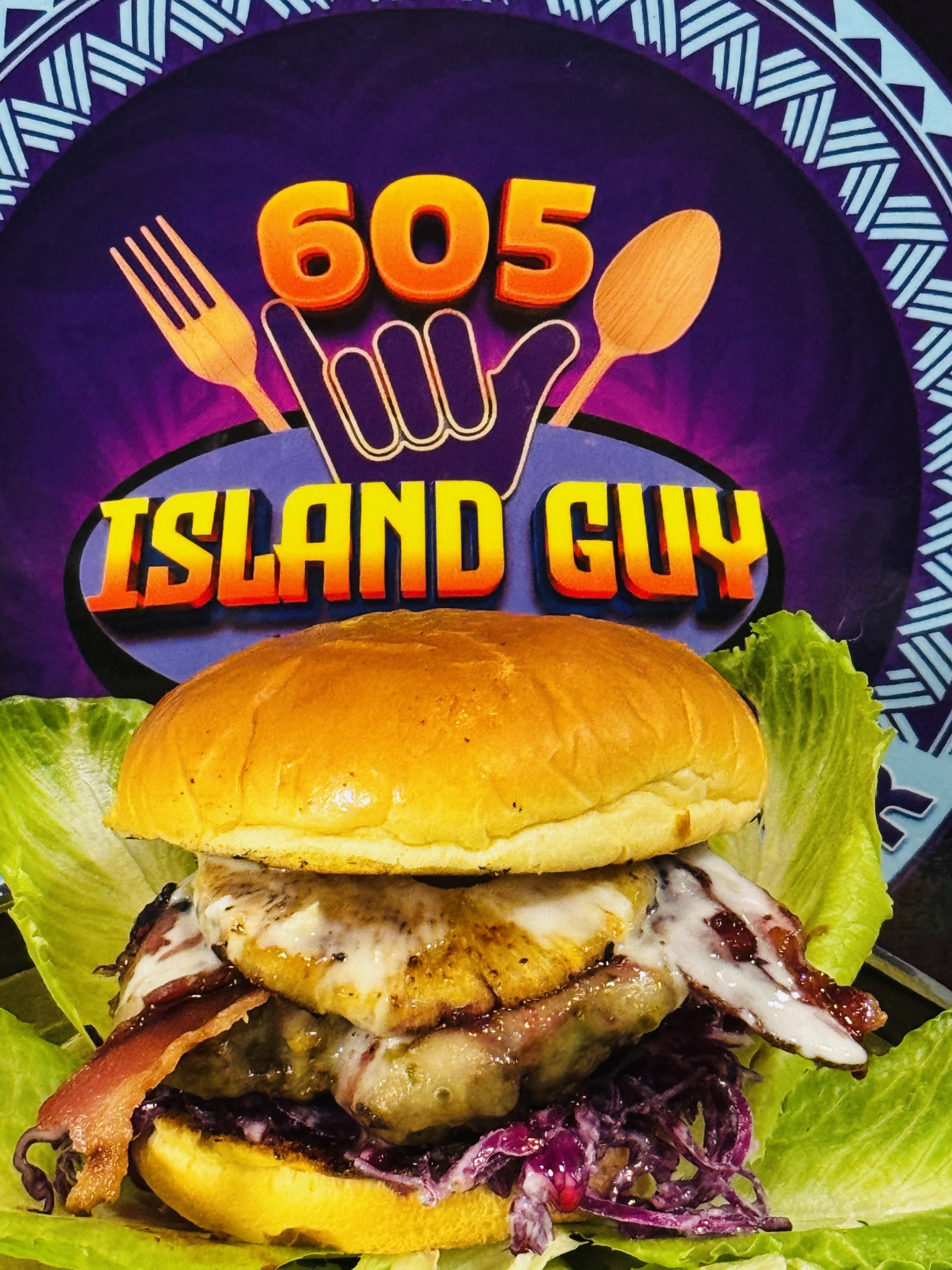 Island Blazed Burger - Hello Hi feat. 605 Island Guy - 8oz seasoned beef patty, peppered jack cheese, charred pineapple, berry’s habanero Jam, crispy bacon, light-Coconut like slaw and drizzled with pineapple aioli sauce. 