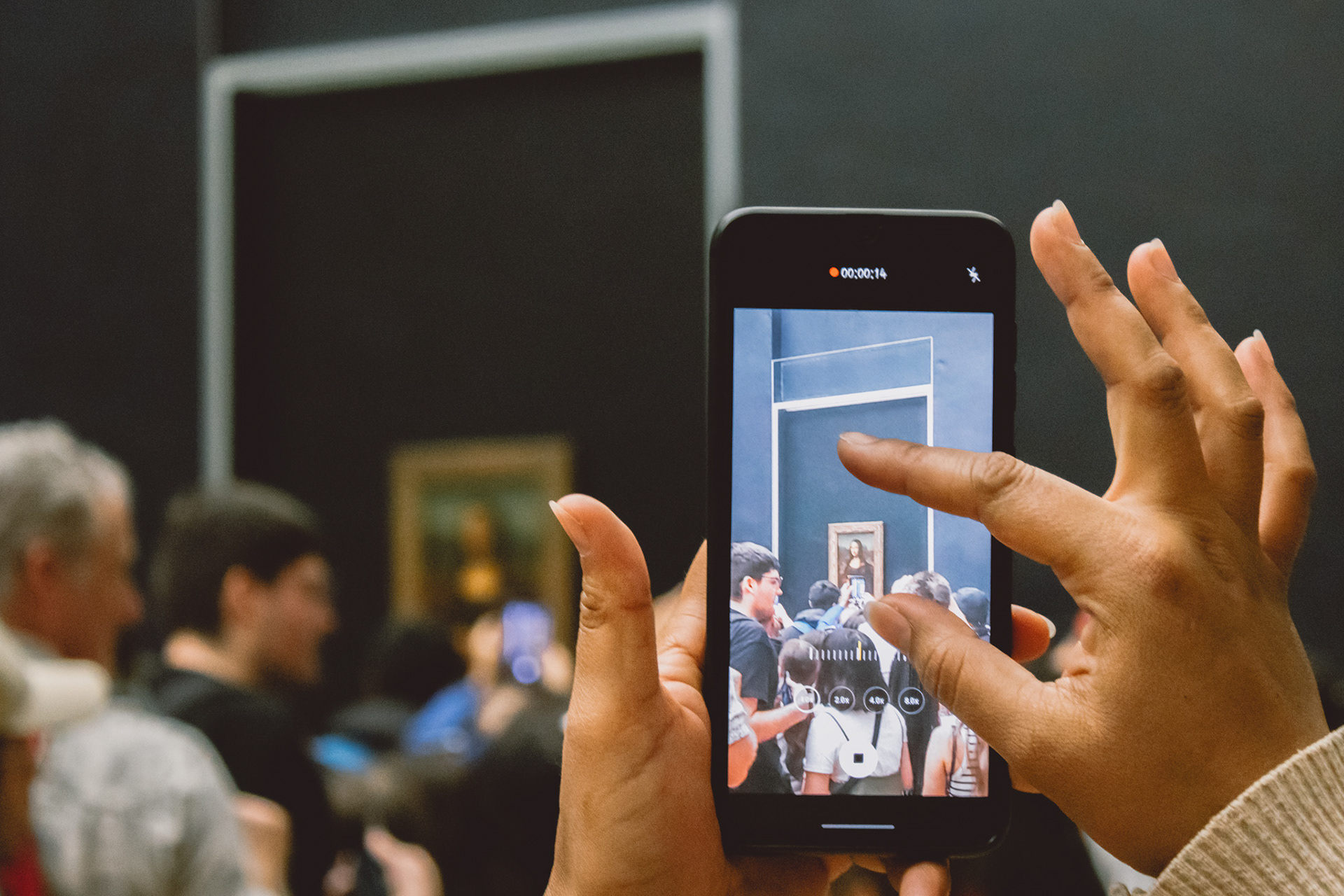 Someone capturing the Mona Lisa