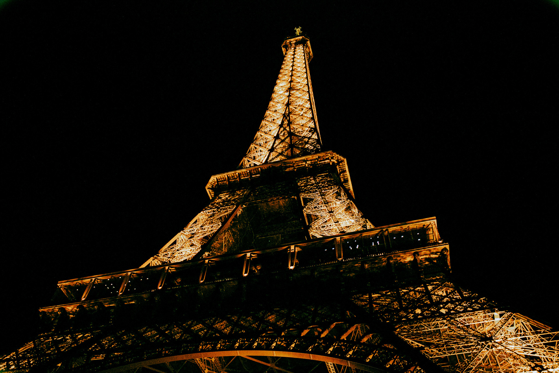 The Eiffel Tower at night during a light show.