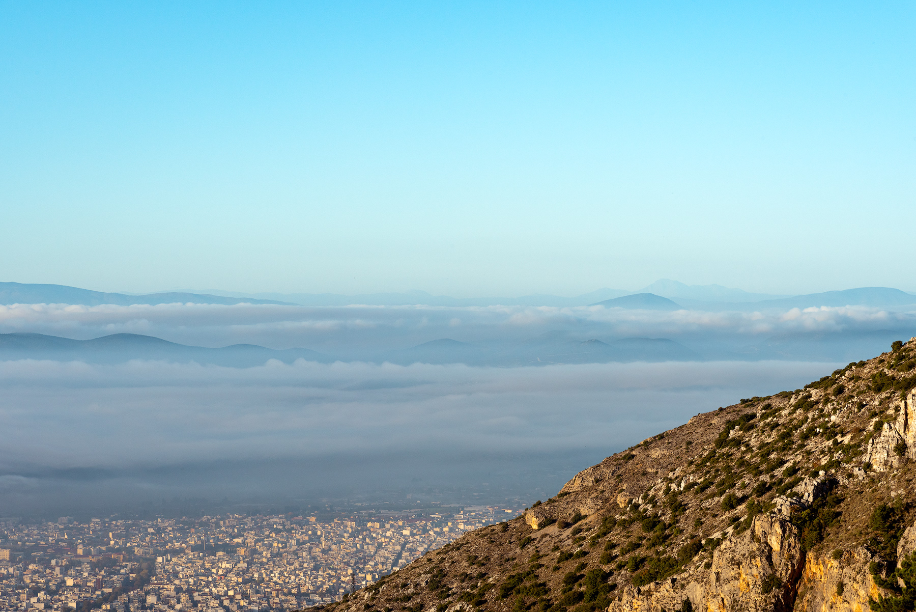 Partial view of Mount Pelion from Makrinitsa with the city of Volos in the distance