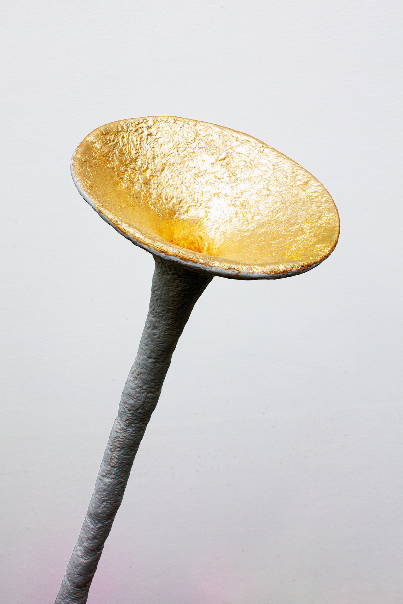 A goldleaf funnel offers entry to the memories.