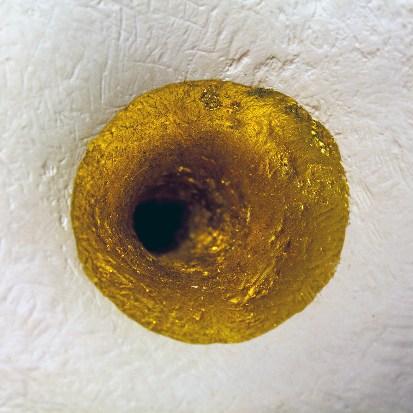 A goldleaf funnel offers entry to the memories held at the back of the heart.