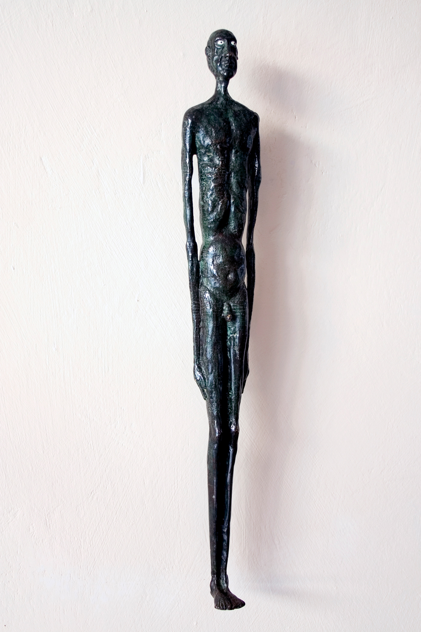 Man on the Wall. Bronze, 43 x 6 x 4 cm.