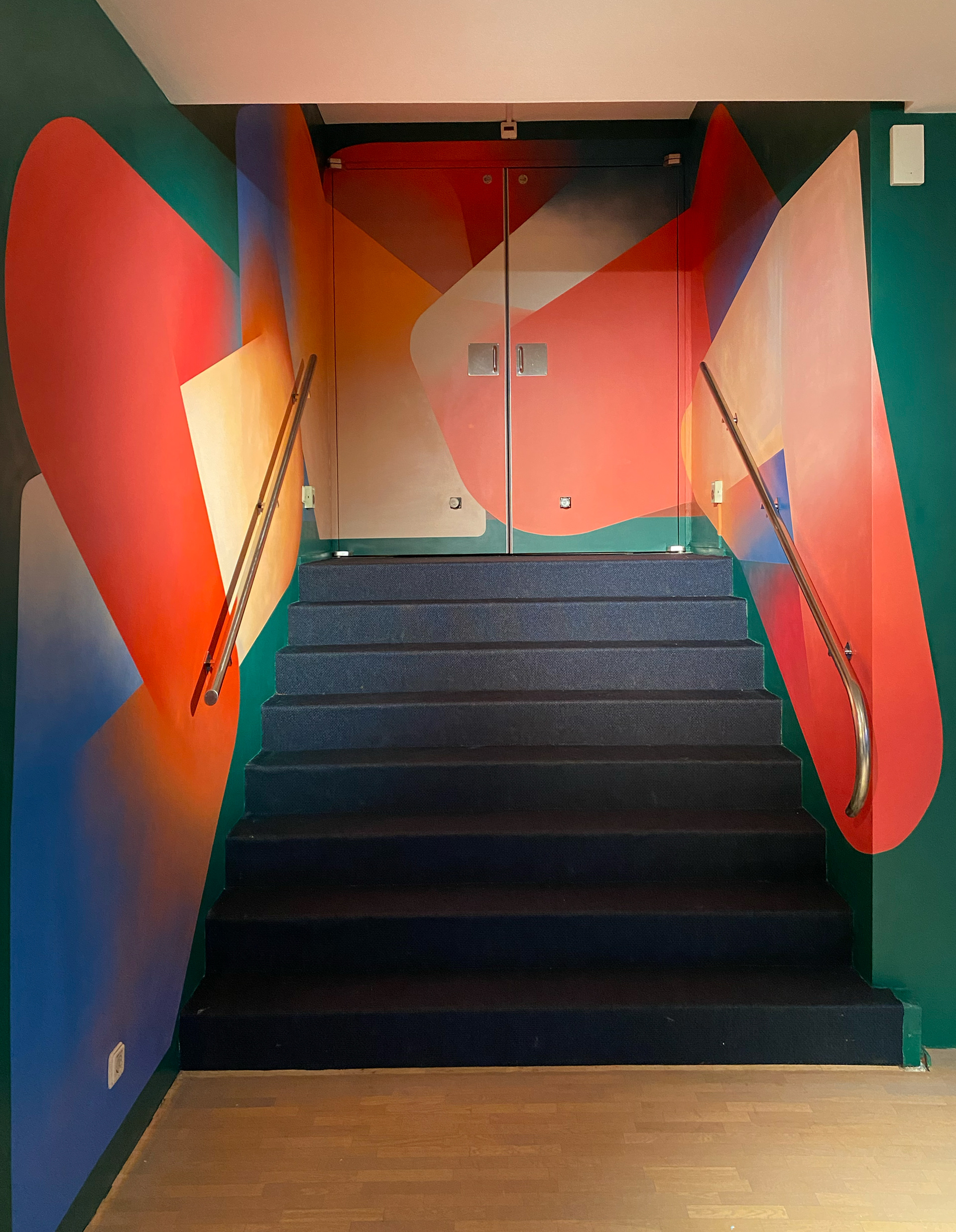 Interior painting in stairway. Spray paint on wall 2,20x9 meter. Theatre Zoetermeer. Tobias Becker Hoff 2023©