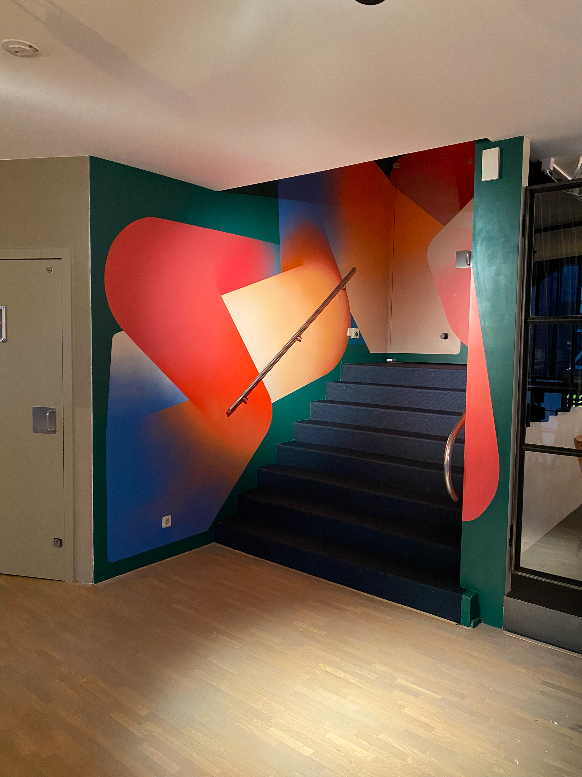 Interior painting in stairway. Spray paint on wall 2,20x9 meter. Theatre Zoetermeer. Tobias Becker Hoff 2023©