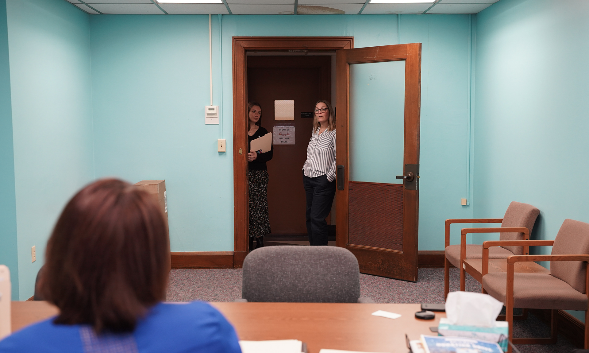 From left, Logan Flori, a fellow Holistic Defense Services team member and Annie Legomsky, the head of HDS, talk with Lewis about a case in her office on Wednesday, Feb. 5, 2025 in St. Louis. “MSPD launched the HDS program in 2022 in response to long-term planning initiative where MSPD staff overwhelmingly requested the support of social workers in their offices,” Legomsky said. Currently, it is made up of full-time social workers, social worker student interns, AmeriCorps Holistic Advocates, and Partners for Justice employees across the state.