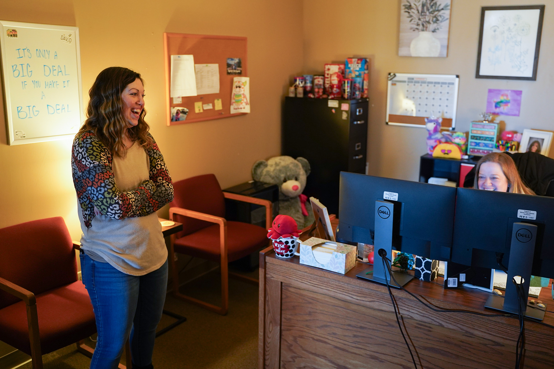 Rowe chats with her friend and co-worker Jamie Malinda on Friday, Jan. 24, 2025, in Rolla, Mo. They joked about how big their kids are getting. Rowe can be described as a “Mom” of the office as well, whether it is being the ears to her co-workers coming to her to vent about life, or giving the winter gloves off of her hands to a client who’s in need of them during the winter months.