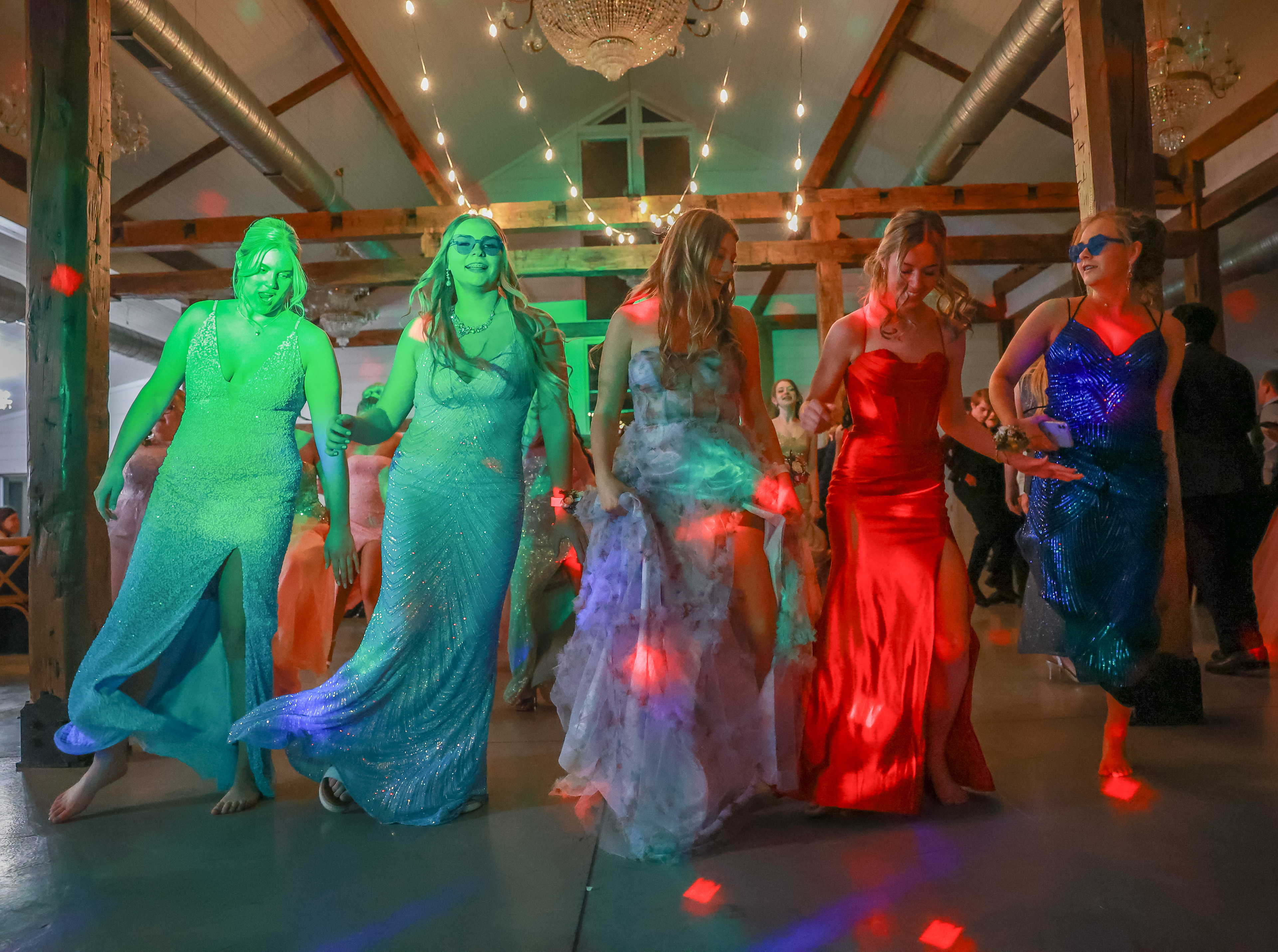 Owensville High School students line dance to "Cotton Eyed Joe" on Saturday, April 20, 2024, at Red Oak Valley, in Owensville, Mo. The night was filled with a mix of 2000s hits, 1950s classic songs and country staples.