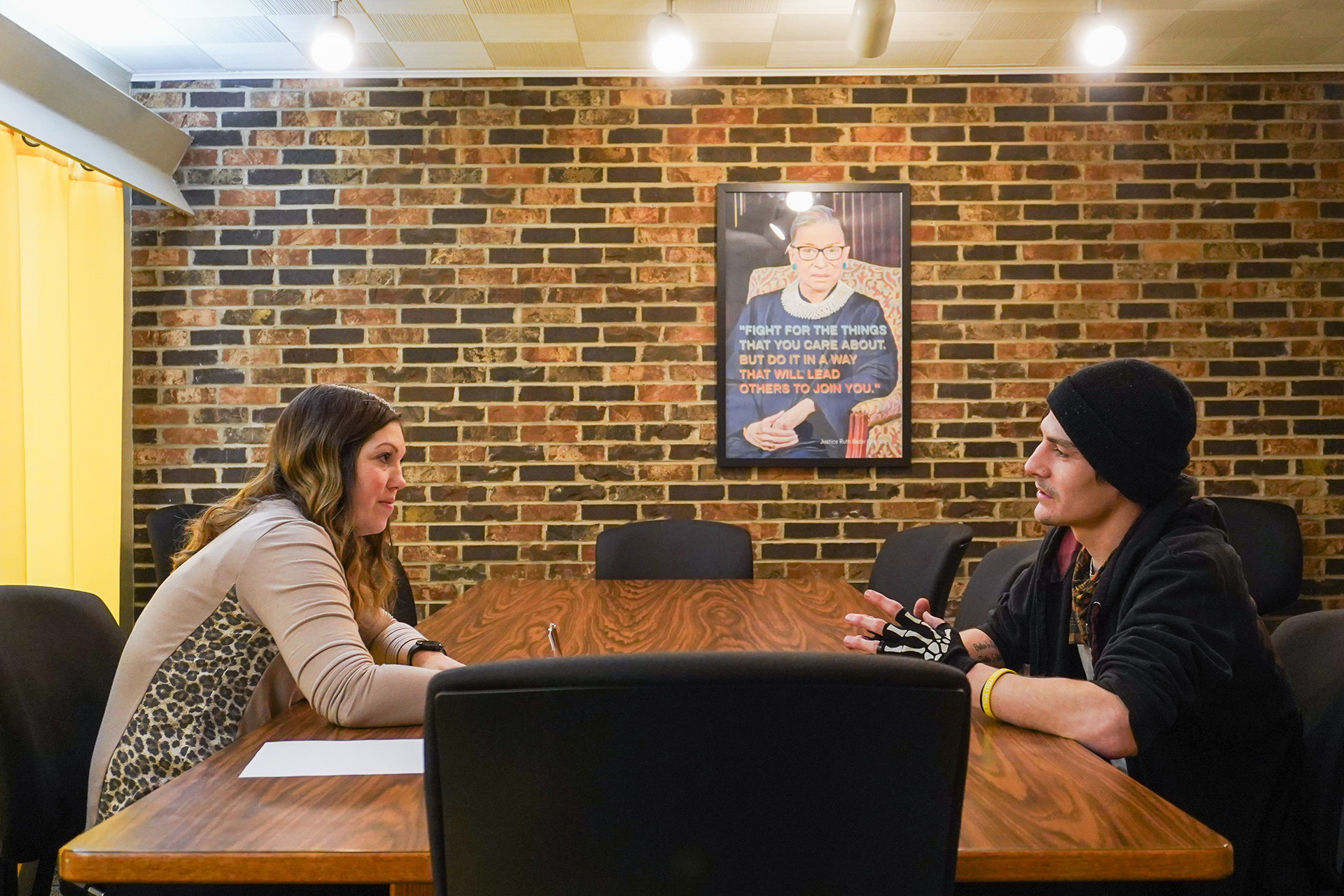Brittney Rowe, left, sits with client Dustin Hardcastle on Wednesday, Jan. 29, 2025, at the Lebenon trial office, in Lebenon, Mo. Rowe is sitting with Hardcastle to finalize a mitigation memo, which they hope will allow Hardcastle to receive probation on a DUI charge instead of prison time. The memo is to give “Some sort idea of you so they [prosecutors and judges] see you differently.” In the eyes of Rowe, Hardcastle has “absolutely turned his life around” since she first began work on his case.  