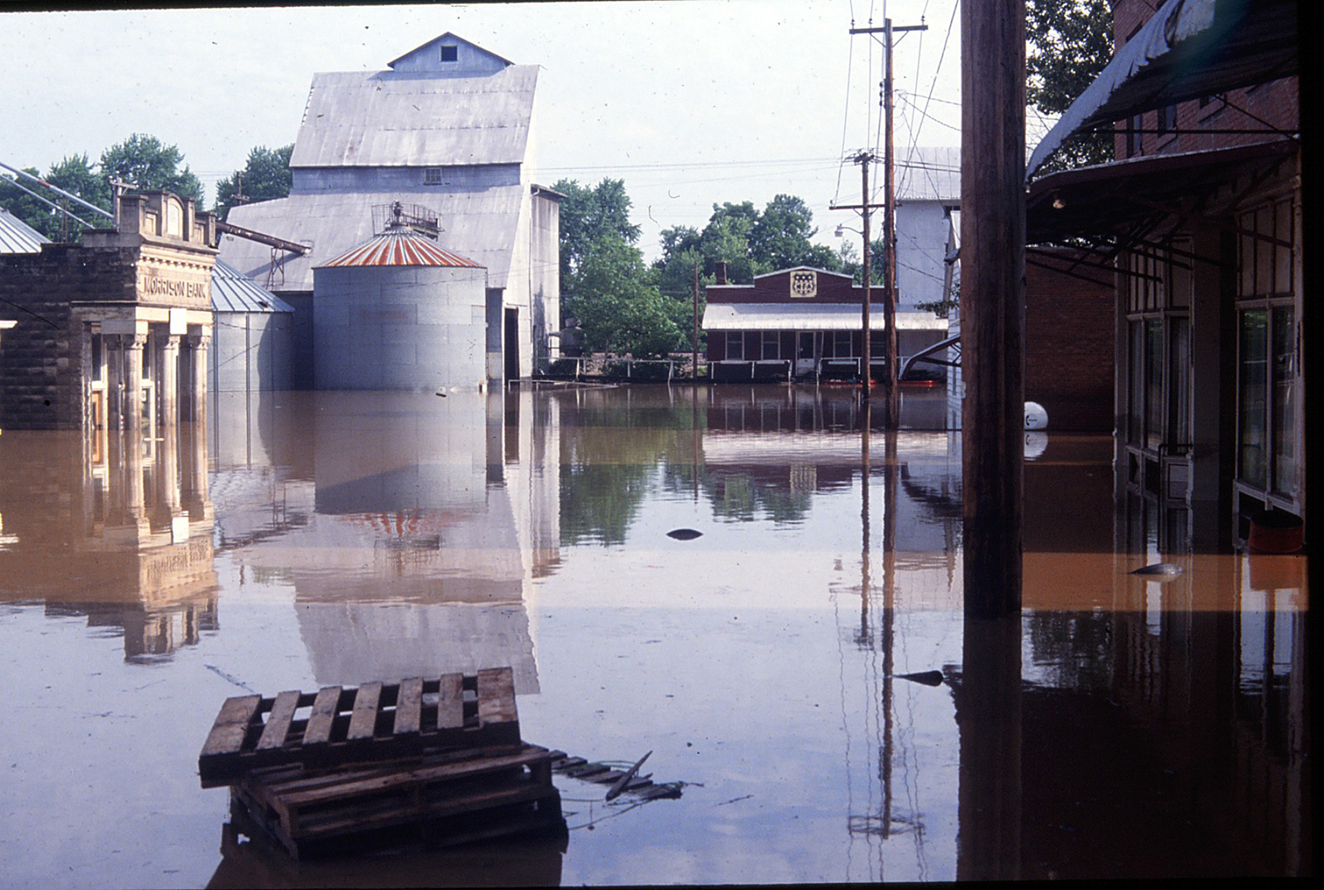 An archival photo of Morrison’s Main Street after the flood of 1993, courtesy of Charley Rost. The flood changed everything about the town. "Before the flood Morrison supported a Catholic Church, a hardware store, a bank, a beauty salon, an MFA cooperative, a grocery store, a tavern, and a Post Office. Though not necessarily considered a thriving community it still had reasonable potential. One by one the businesses closed, first the grocery at the corner of 1st and Main closed. After that the bank closed and eventually businesses folded until today we are left with the Catholic Church (which parishioners extensively remodeled) and a Post Office.”