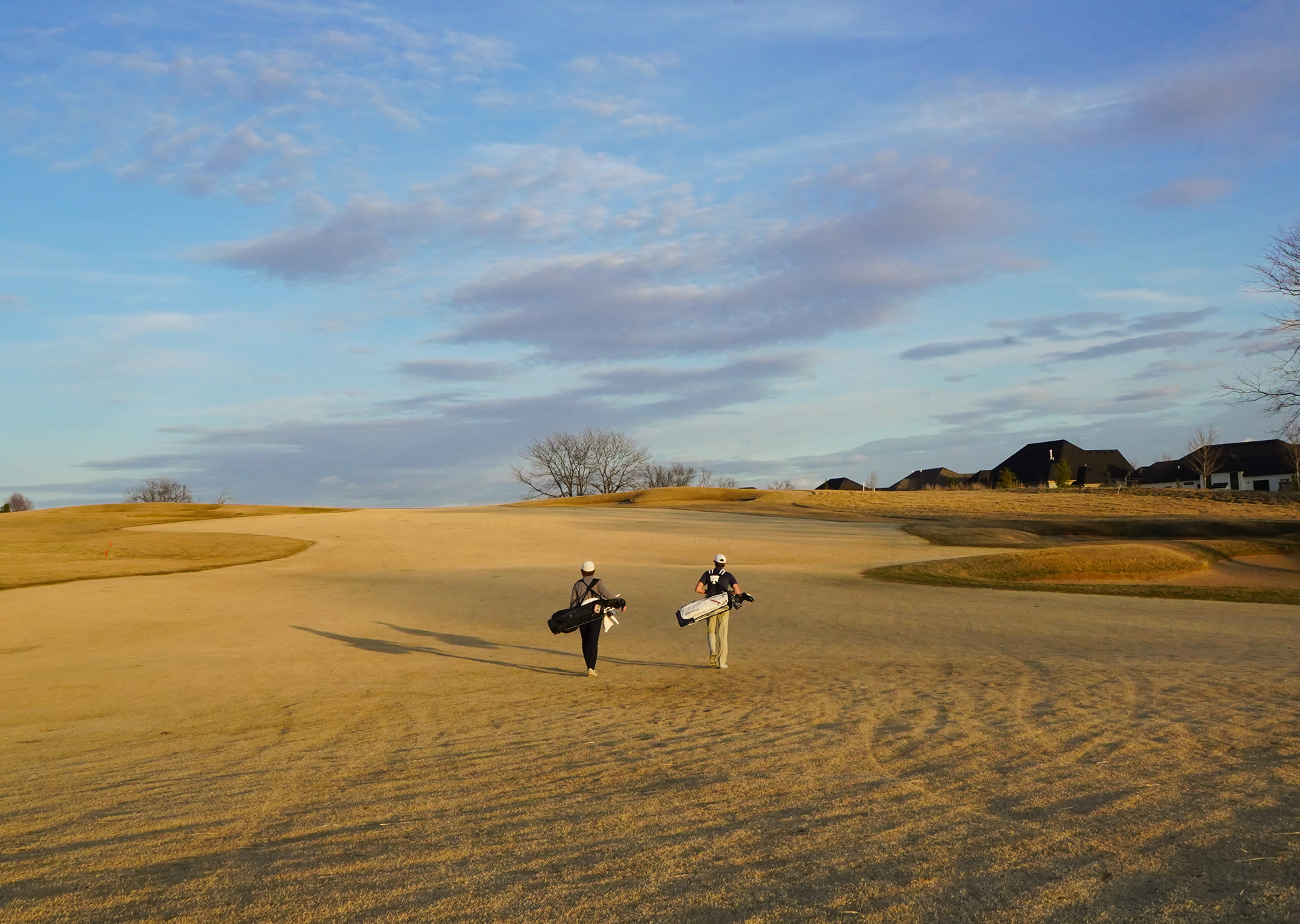 Grant Hughes, left, and Graham Hoffman, right, walk down the fairway on Friday, Feb. 23, 2024, at The Club at Old Hawthorne, in Columbia, Mo. Hoffman is attending the Air Force Academy after graduation, with a plan to major in political science. He will choose political science, as that major at military academy has a lot to offer in that field compared to state schools. 