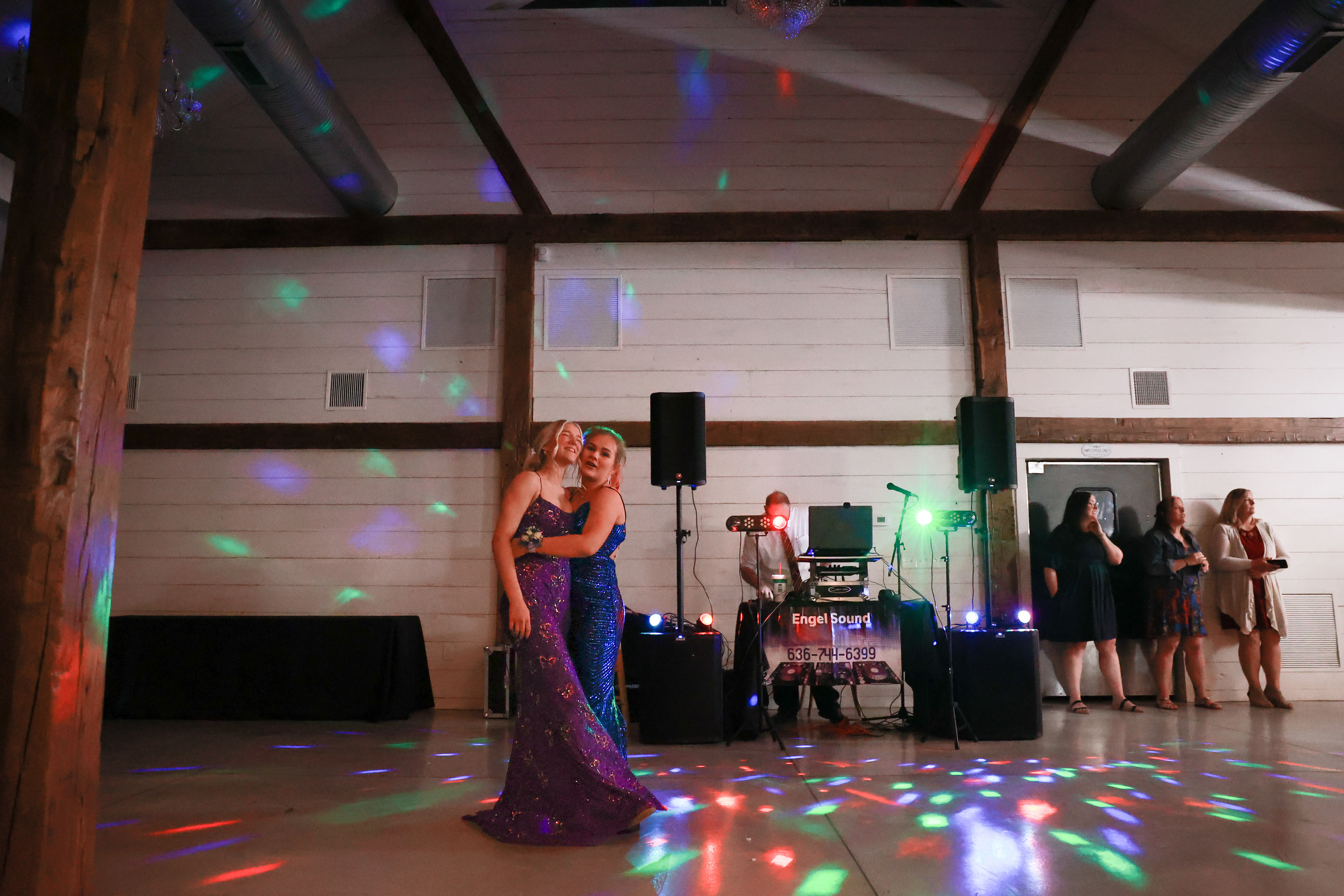 From left, Owensville High School’s Alaina Carpenter and Lauren Kandlbinder embrace after dancing to Natasha Bedingfield’s “Unwritten” on Saturday, April 20, 2024 at Red Oak Valley in Owensville, Mo. 