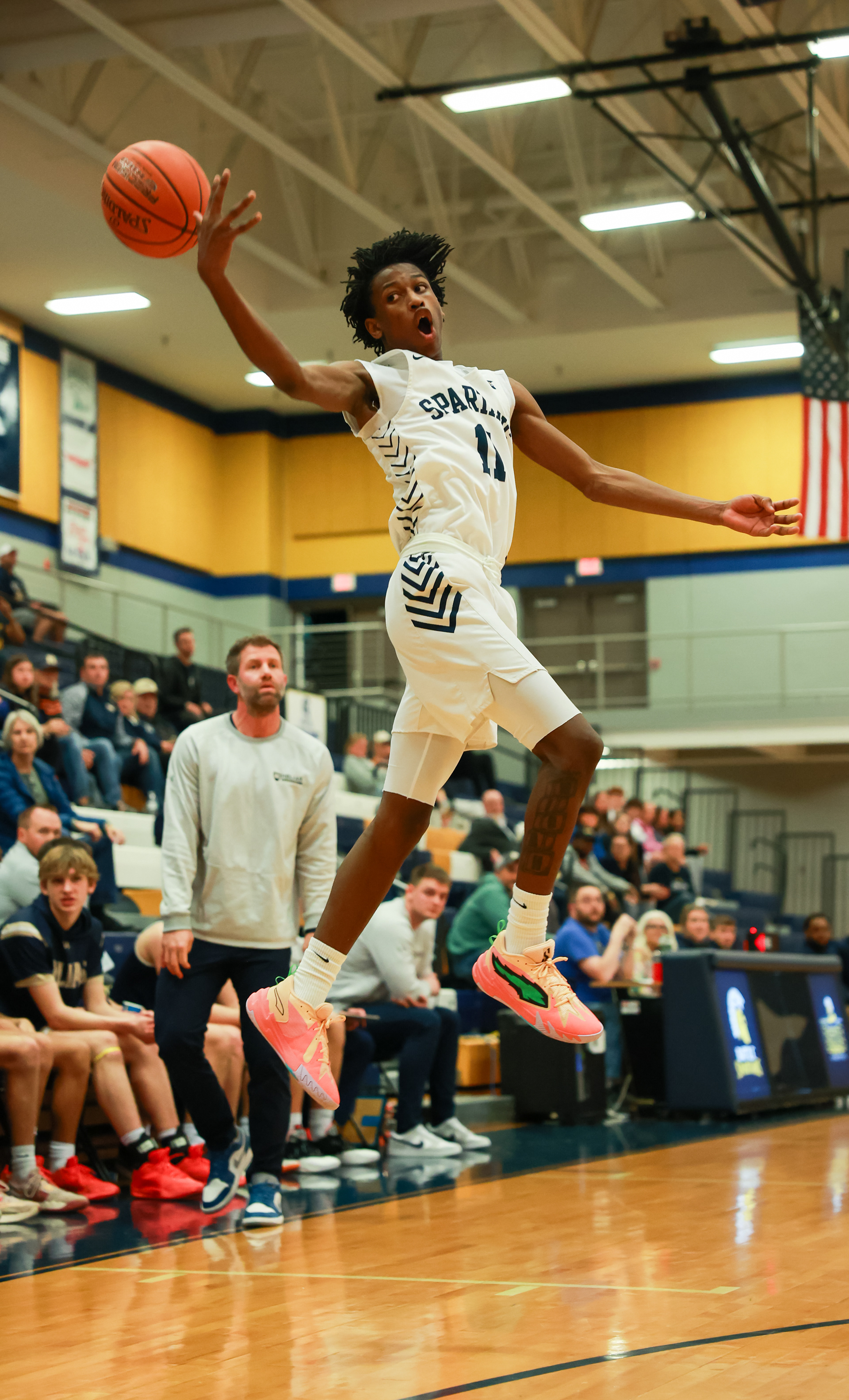 Battle High School guard Ke’yion Cross leaps to catch a pass on Friday, Feb. 9, 2024, at Battle High School in Columbia, Mo. Battle’s record stands at 18-4.