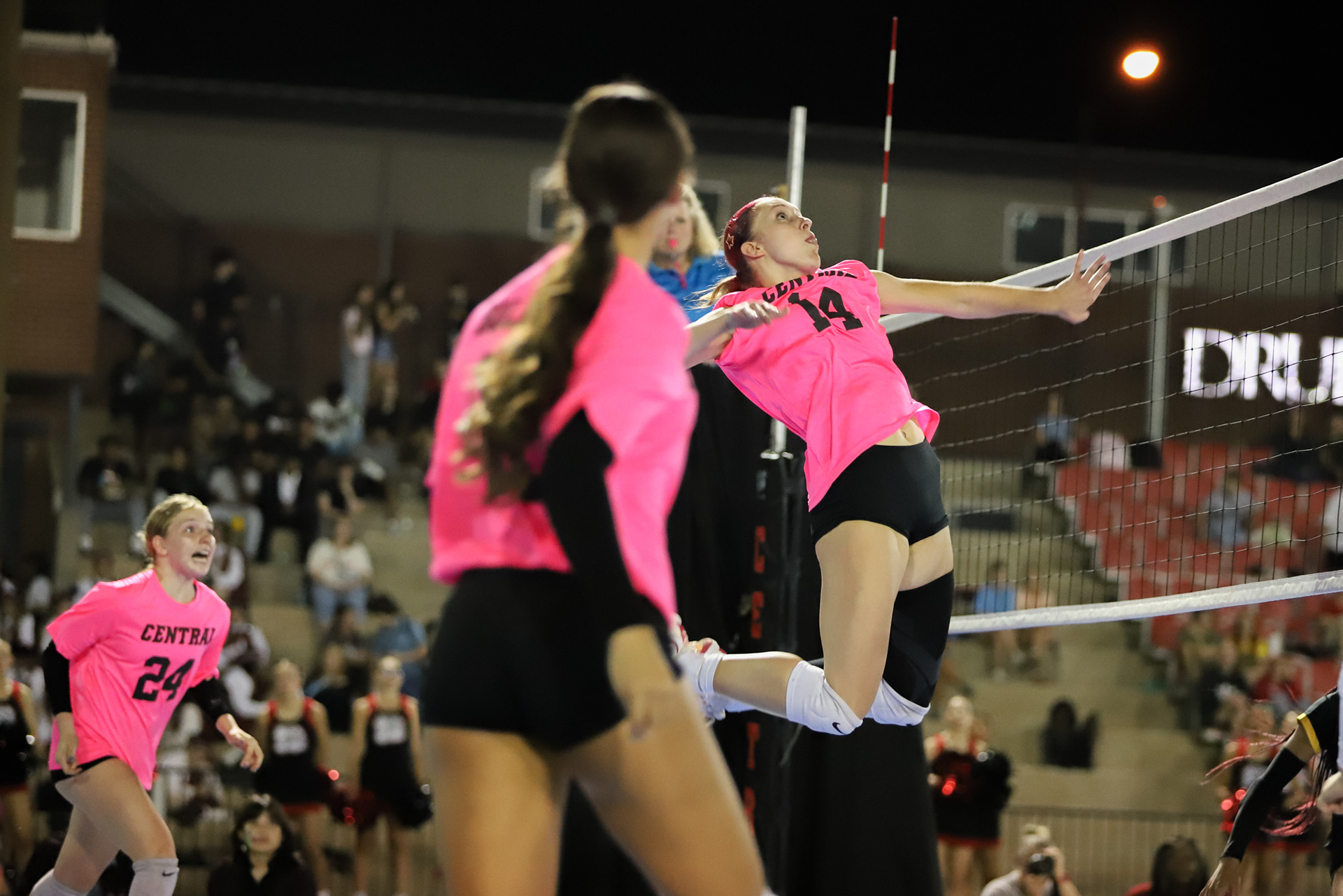 Central's Zella Gosnell jumps to spike the ball on Thursday, Oct. 2, 2025, at Harrison Stadium in Springfield. The outdoor volleyball games were rare sight for the area. The games also served as the Homecoming festivities, as Central's football season was cancelled due to a lack of players. 