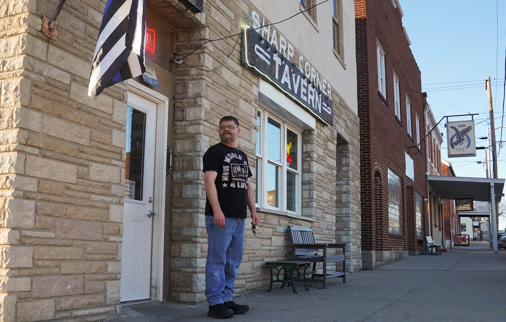 Sharp Corner Tavern co-owner Toby Hoelmer walks out of his tavern on Friday, March 15, 2024 at Sharp Corner Tavern in Hermann, Mo. The Tavern is a stalwart of the mid-Missouri river town. The building is 167 years old and has been serving Midwestern fare to customers for decades.