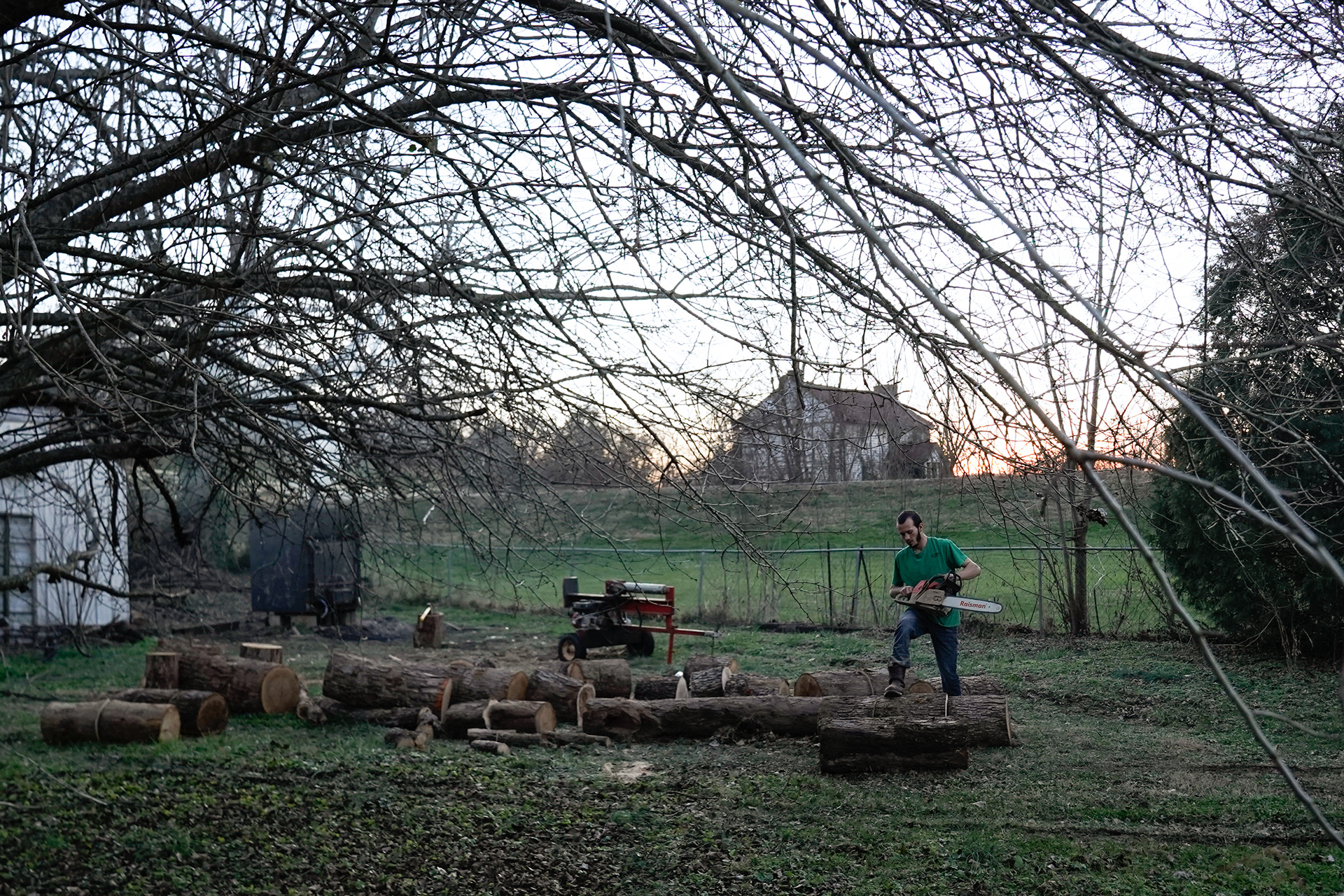 Christian Strope chops wood to feed his wood stove heater in Morrison. Strope bought the 2,400 square foot house for $8,000 after it was unoccupied for about a decade. Strope works in Jefferson City for Hitachi and chose Morrison in part because his Mom lives up the hill in town.