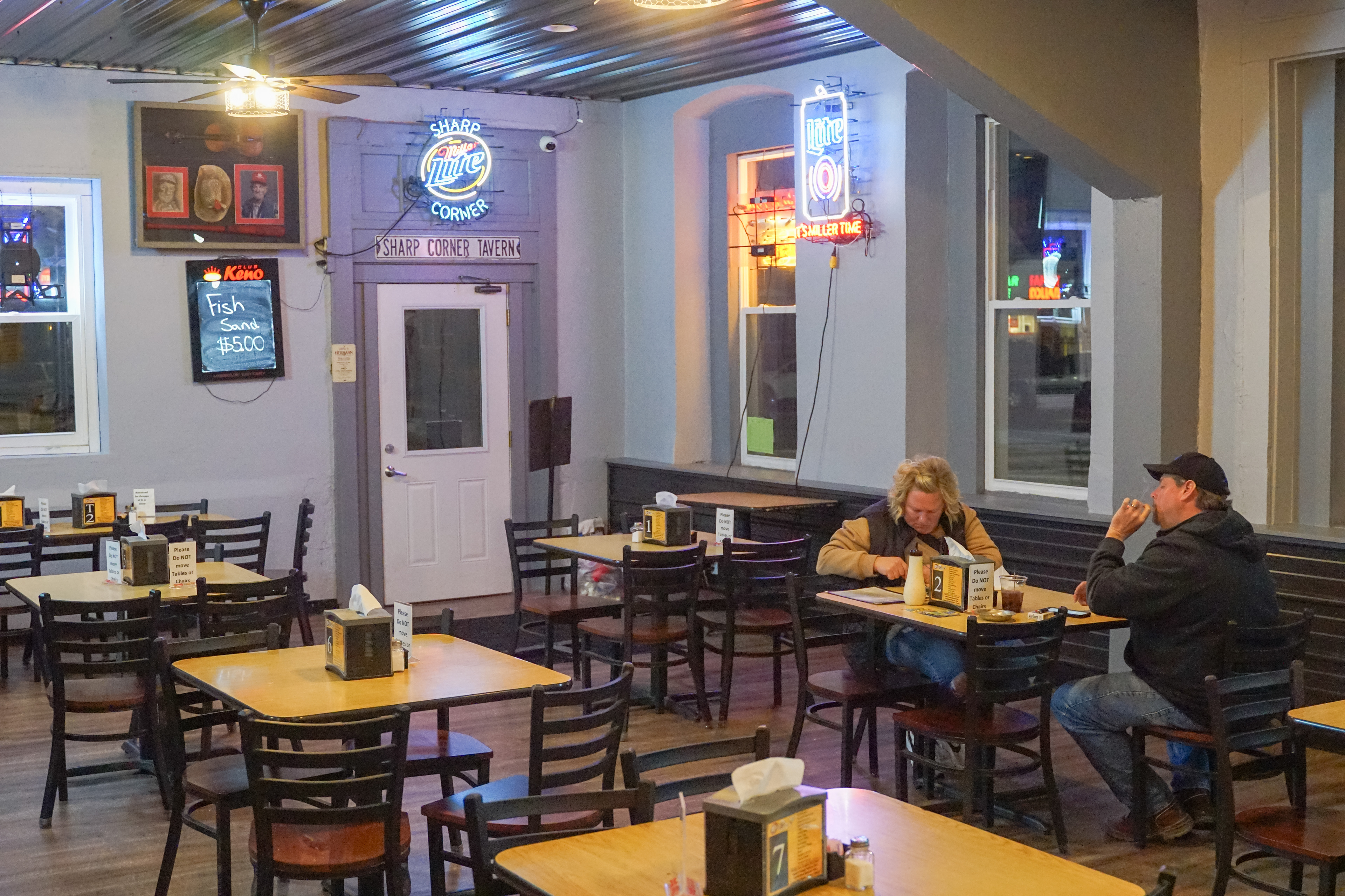 Sharp Corner Tavern customers finish dinner on Friday, March 22, 2024, in Hermann, Mo. When the sun sets, smoking restrictions normally enforced during the lunch rush are lifted. When Toby and Sarah leave, night cook Cody Manley (cq) and night manager Travis Bruesking (cq) often close the bar late into the night. “Y’all aren’t closed are you?” A customer said around 9:00 p.m. “No, everyone just left at once. We’ve still got a few more hours” Bruesking said in response.