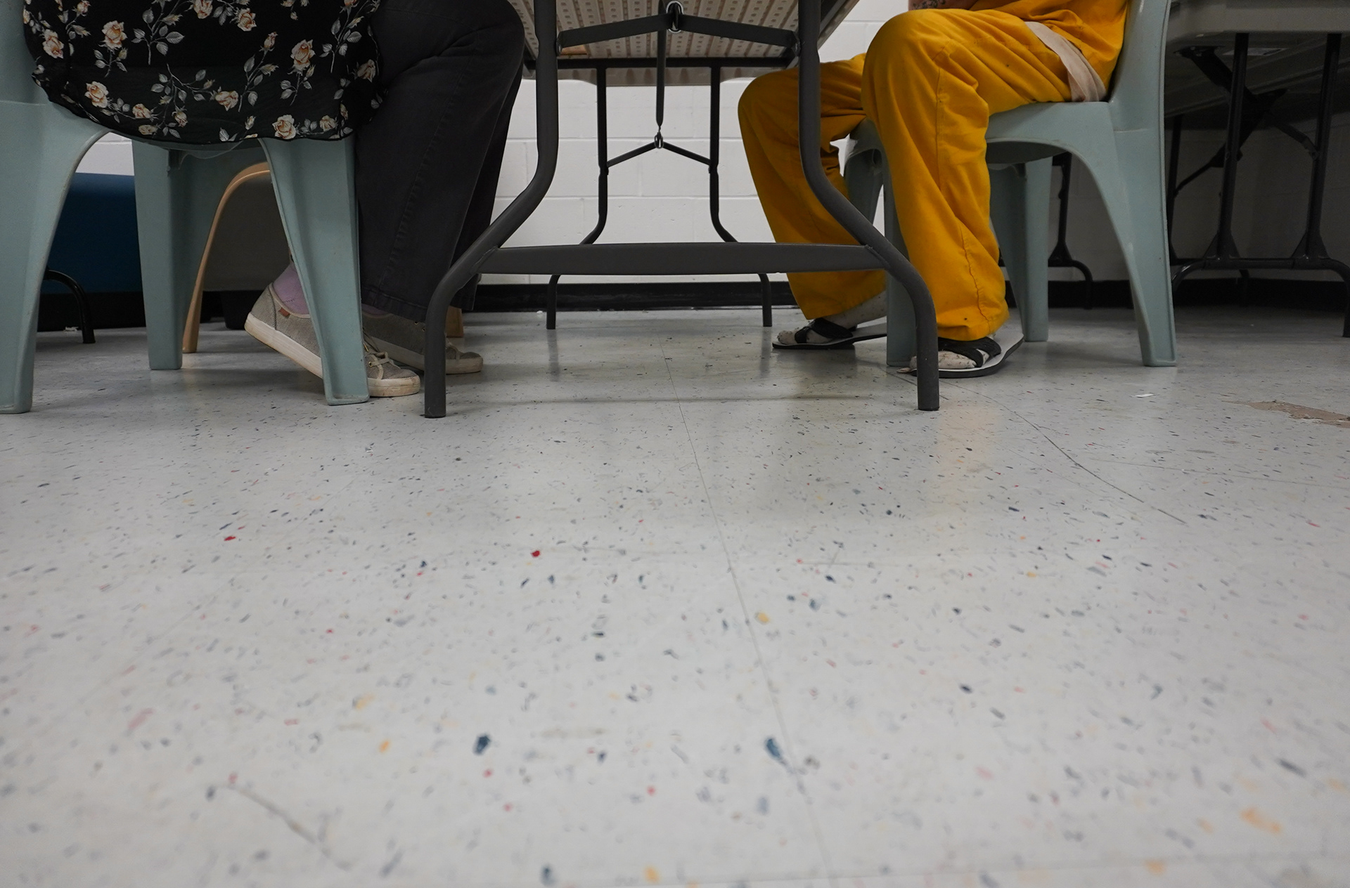 Lewis sits with a client in the St. Louis while she completes their oral history in the city jail on Wednesday, Feb. 26, 2025, in St. Louis. Oral histories aren’t often the easiest tasks to complete. They can take hours at a time, sometimes taking three or more visits to complete to build trust with the clients. Often clients’ stories are filled with abuse, trauma and past criminal activity. They also describe the client’s strengths, their support system and the successes they’ve had in their lives before being charged with a crime.